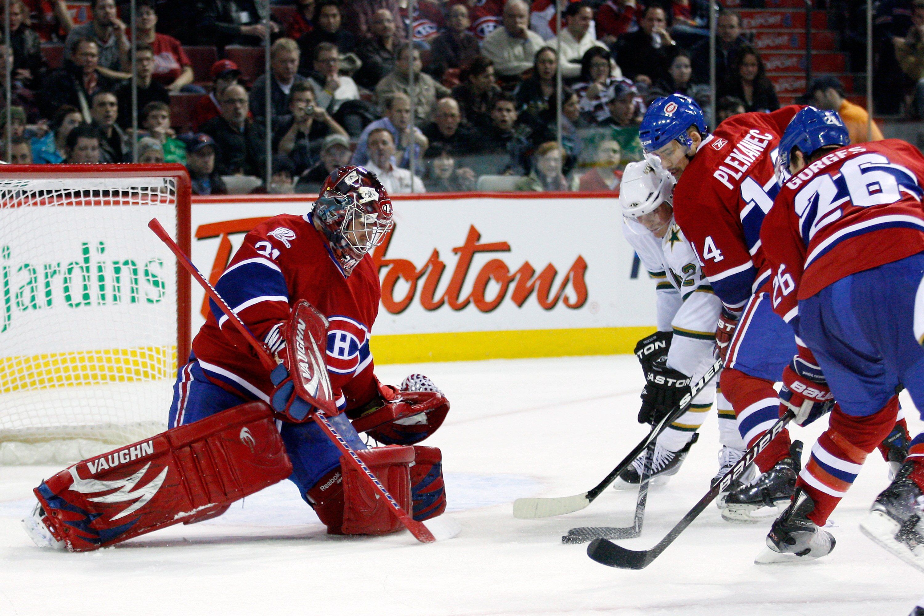 MONTREAL- JANUARY 14: Loui Eriksson #21 of the Dallas Stars and Tomas Plekanec #14 of the Montreal Canadiens battle for the loose puck in front of Carey Price #31 of the Canadiens during the NHL game on January 14, 2010 at the Bell Centre in Montreal, Qu MONTREAL- JANUARY 14: Loui Eriksson #21 of the Dallas Stars and Tomas Plekanec #14 of the Montreal Canadiens battle for the loose puck in front of Carey Price #31 of the Canadiens during the NHL game on January 14, 2010 at the Bell Centre in Montreal, Qu