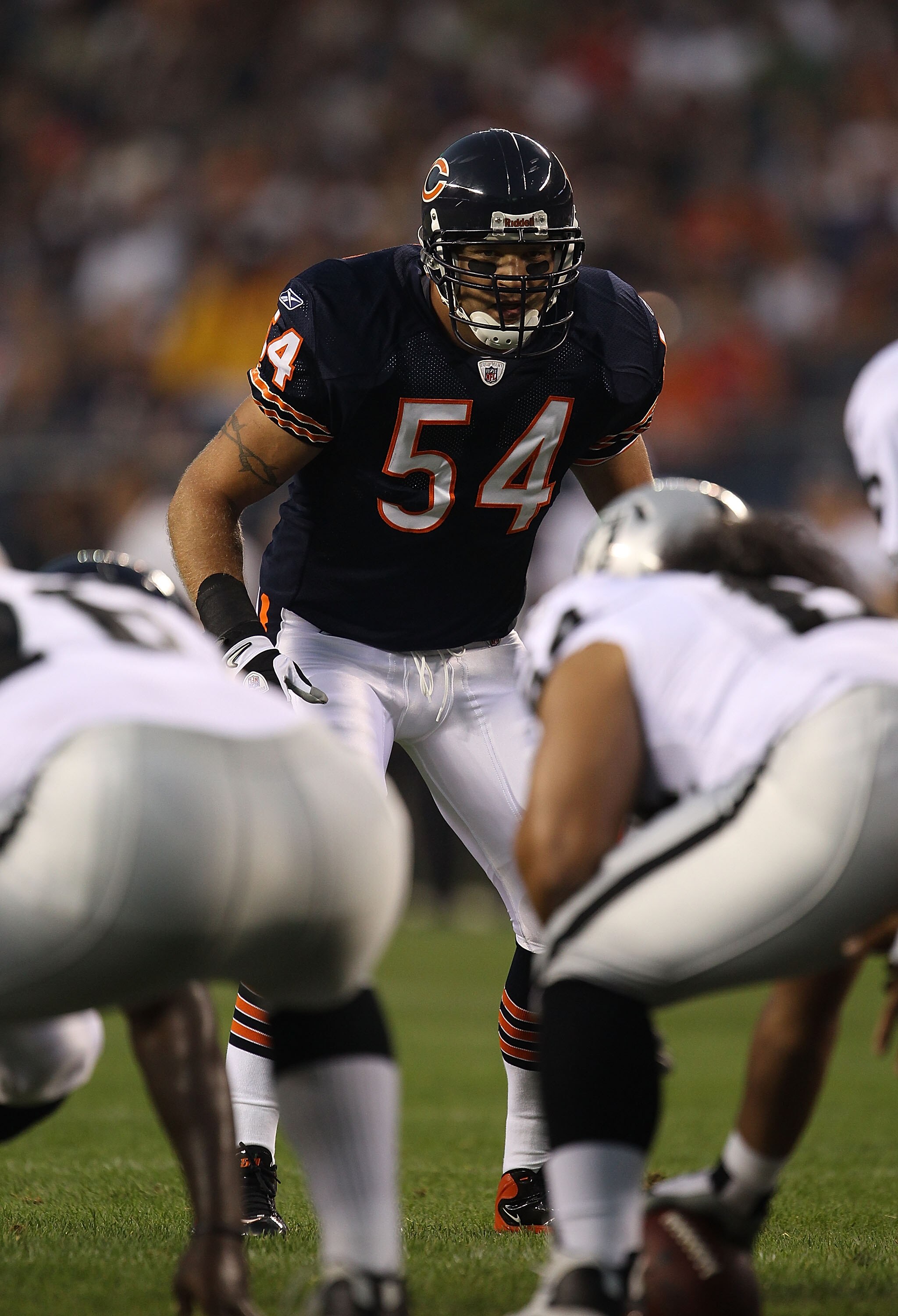 CHICAGO - AUGUST 21: Brian Urlacher #54 of the Chicago Bears awaits the start of play during a preseason game against the Oakland Raiders at Soldier Field on August 21, 2010 in Chicago, Illinois. The Raiders defeated the Bears 32-17. (Photo by Jonathan Da