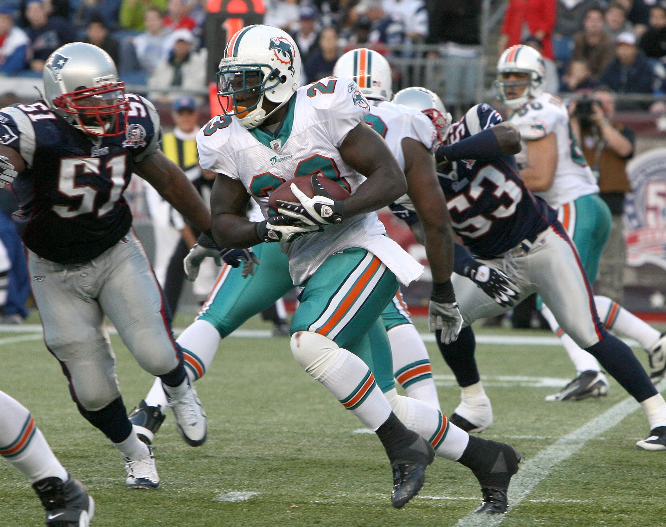 FOXBORO, MA - NOVEMBER 8:  Ronnie Brown #23 of the Miami Dolphons gains yards against the New England Patriots at Gillette Stadium on November 8, 2009 in Foxboro, Massachusetts.  (Photo by Jim Rogash/Getty Images)