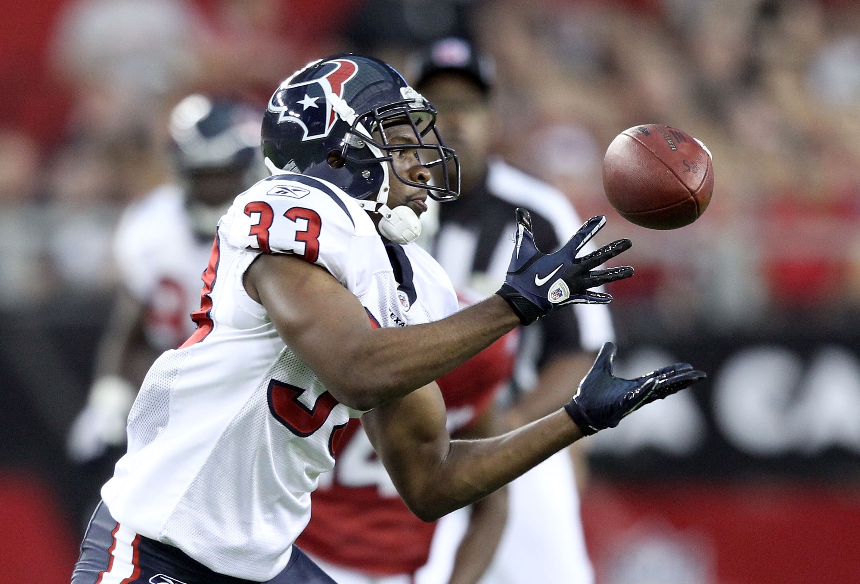 GLENDALE, AZ - AUGUST 14:  Safety Troy Nolan #33 of the Houston Texans intercepts a pass from the Arizona Cardinals during the second quarter of the preseason NFL game at the University of Phoenix Stadium on August 14, 2010 in Glendale, Arizona.  (Photo b