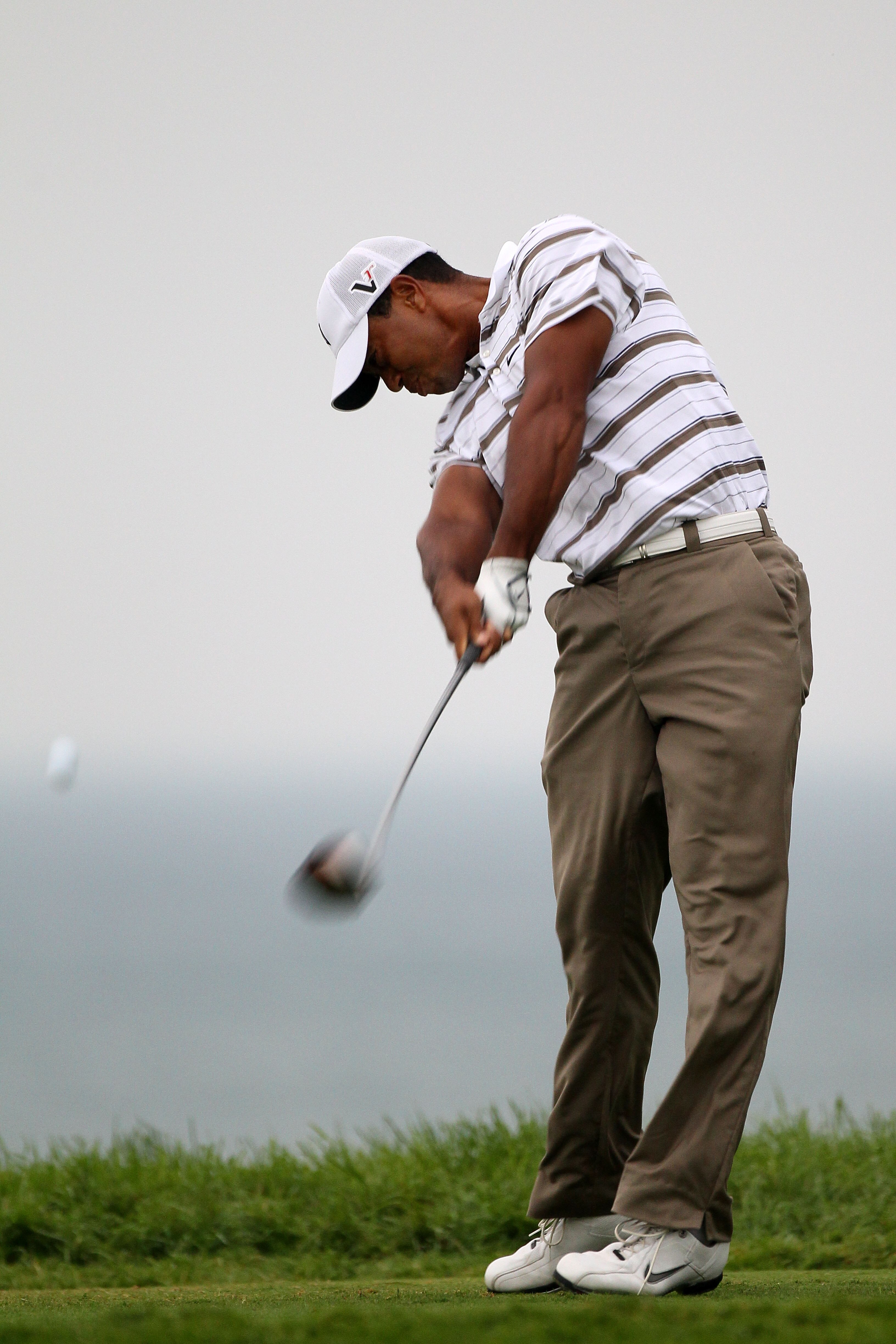 KOHLER, WI - AUGUST 13:  Tiger Woods hits his tee shot on the fifth hole during the second round of the 92nd PGA Championship on the Straits Course at Whistling Straits on August 13, 2010 in Kohler, Wisconsin.  (Photo by Andy Lyons/Getty Images)