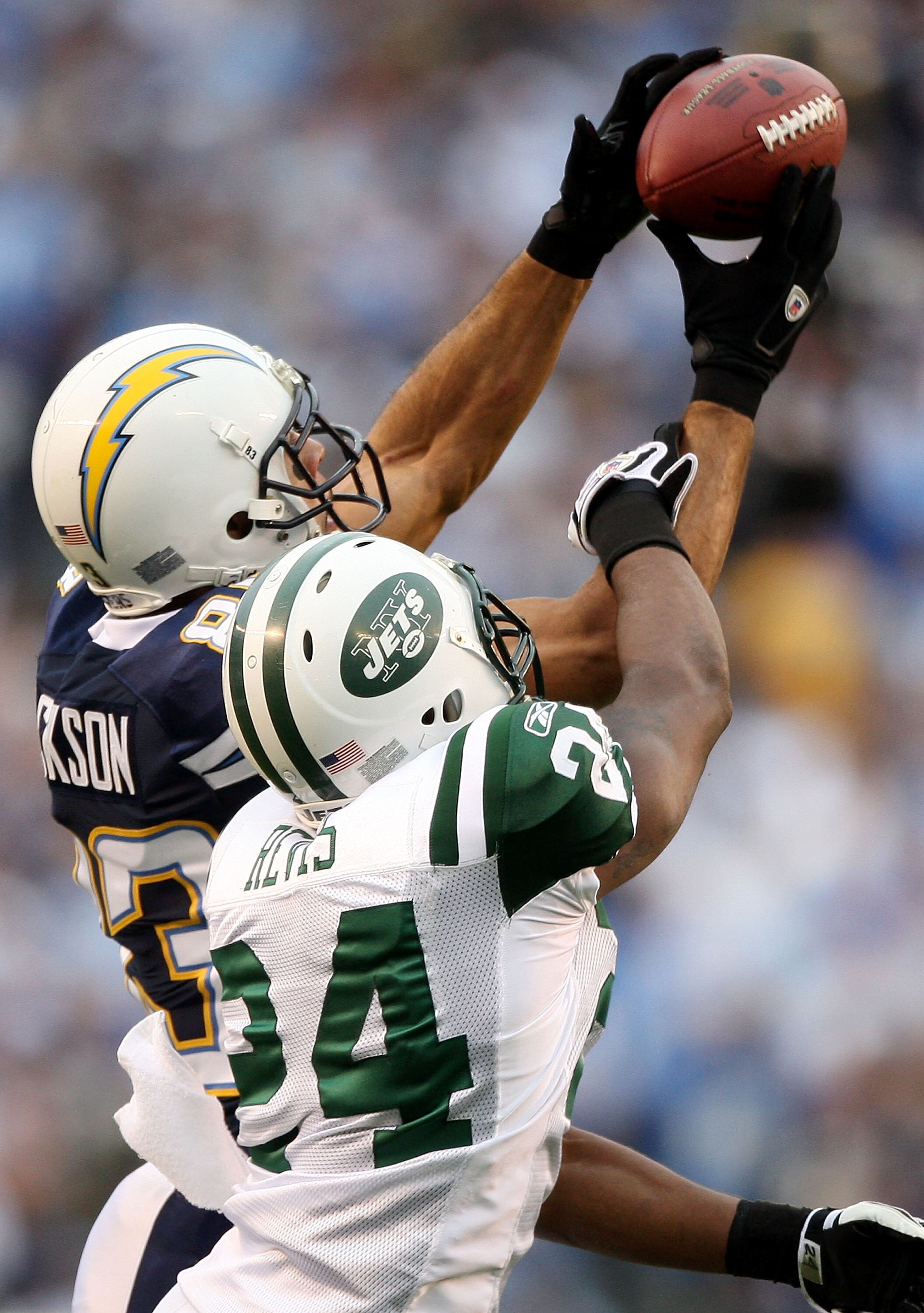 SAN DIEGO - JANUARY 17:  Wide receiver Vincent Jackson #83 of the San Diego Chargers goes up for a catch against Darrelle Revis #24 of the New York Jets during  AFC Divisional Playoff Game at Qualcomm Stadium on January 17, 2010 in San Diego, California. 