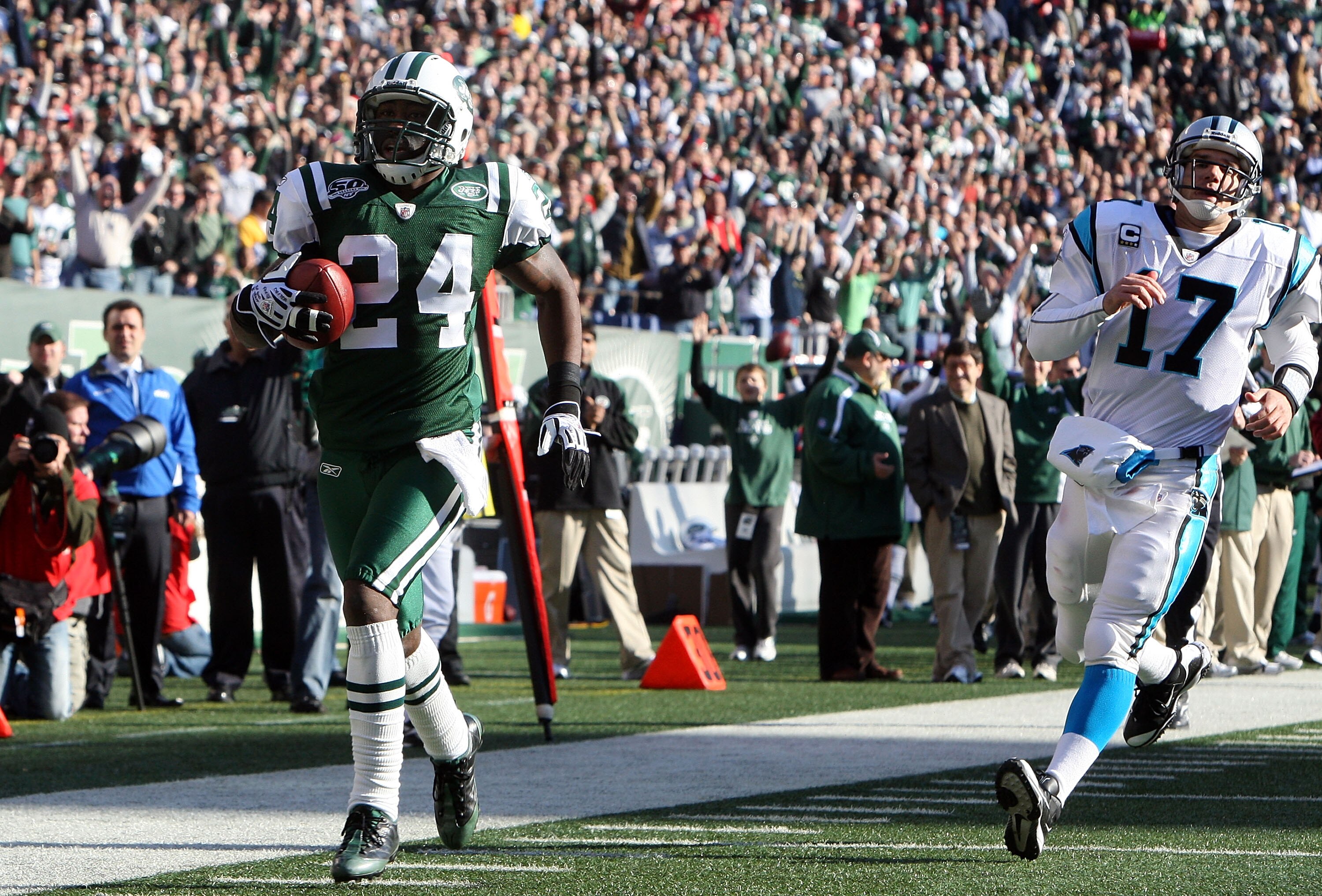 EAST RUTHERFORD, NJ - NOVEMBER 29:  Darrelle Revis #24 of the New York Jets runs the ball in for a first quarter touchdown after an interception against Jake Delhomme #17 of the Carolina Panthers on November 29, 2009 at Giants Stadium in East Rutherford, 