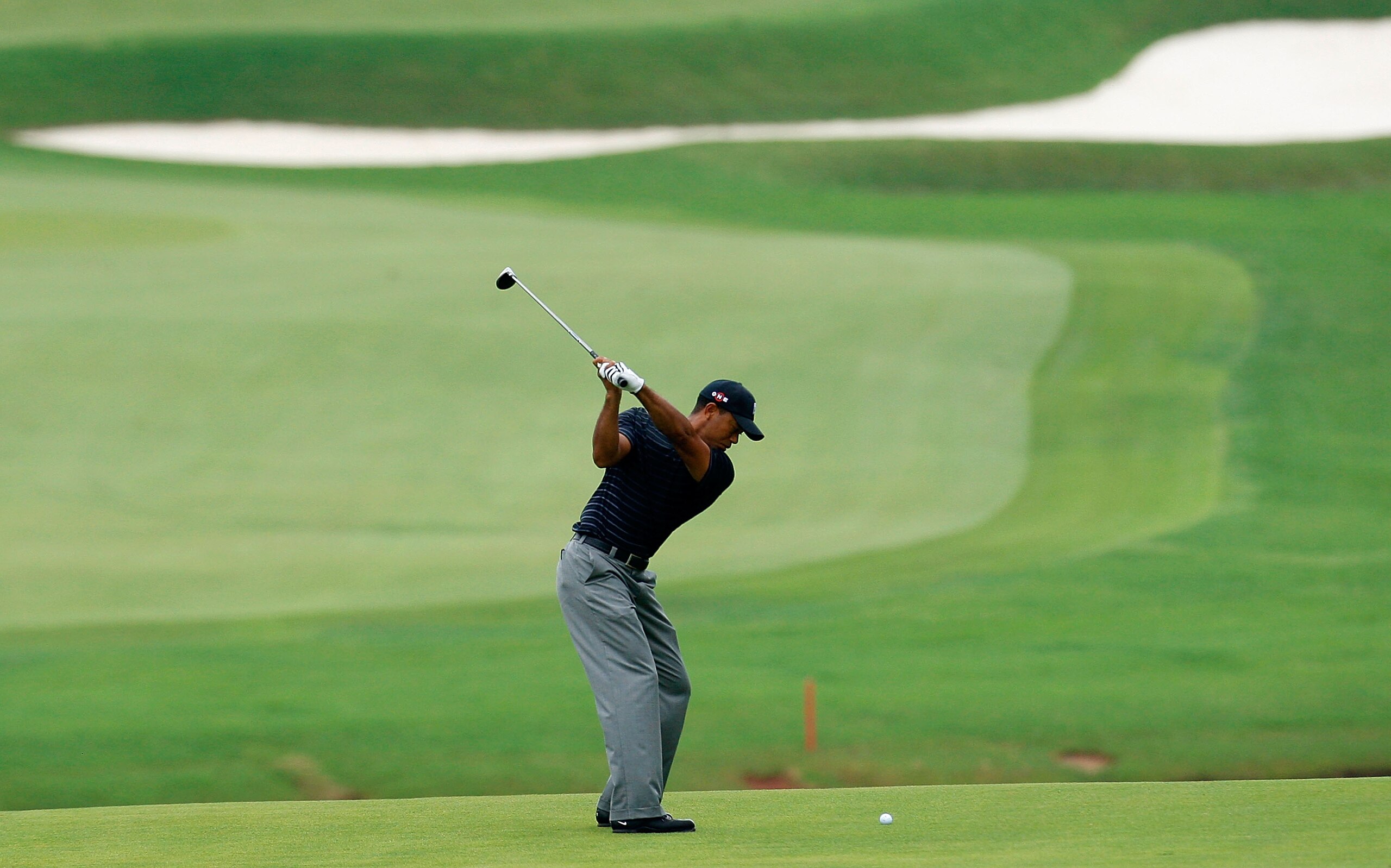 ATLANTA, GEORGIA - SEPTEMBER 26: Tiger Woods plays his second shot from the ninth fairway during the third round of THE TOUR Championship presented by Coca-Cola, the final event of the PGA TOUR Playoffs for the FedExCup, at East Lake Golf Club on Septemb ATLANTA, GEORGIA - SEPTEMBER 26: Tiger Woods plays his second shot from the ninth fairway during the third round of THE TOUR Championship presented by Coca-Cola, the final event of the PGA TOUR Playoffs for the FedExCup, at East Lake Golf Club on Septemb