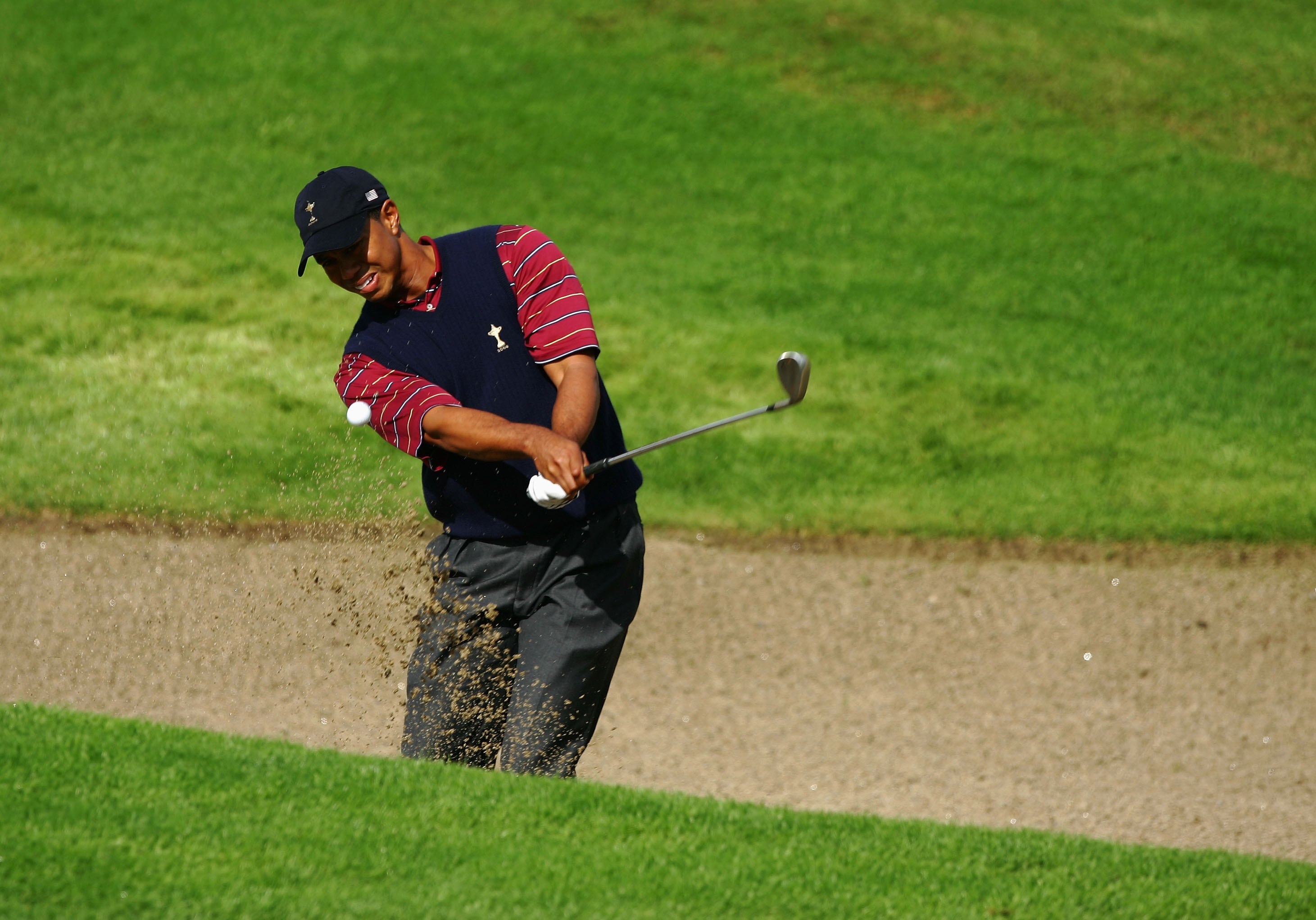 KILDARE, IRELAND - SEPTEMBER 24:  Tiger Woods of USA hits out of a bunker during his singles match against Robert Karlsson of Europe on the final day of the 2006 Ryder Cup at The K Club on September 24, 2006 in Straffan, Co. Kildare, Ireland.  (Photo by D