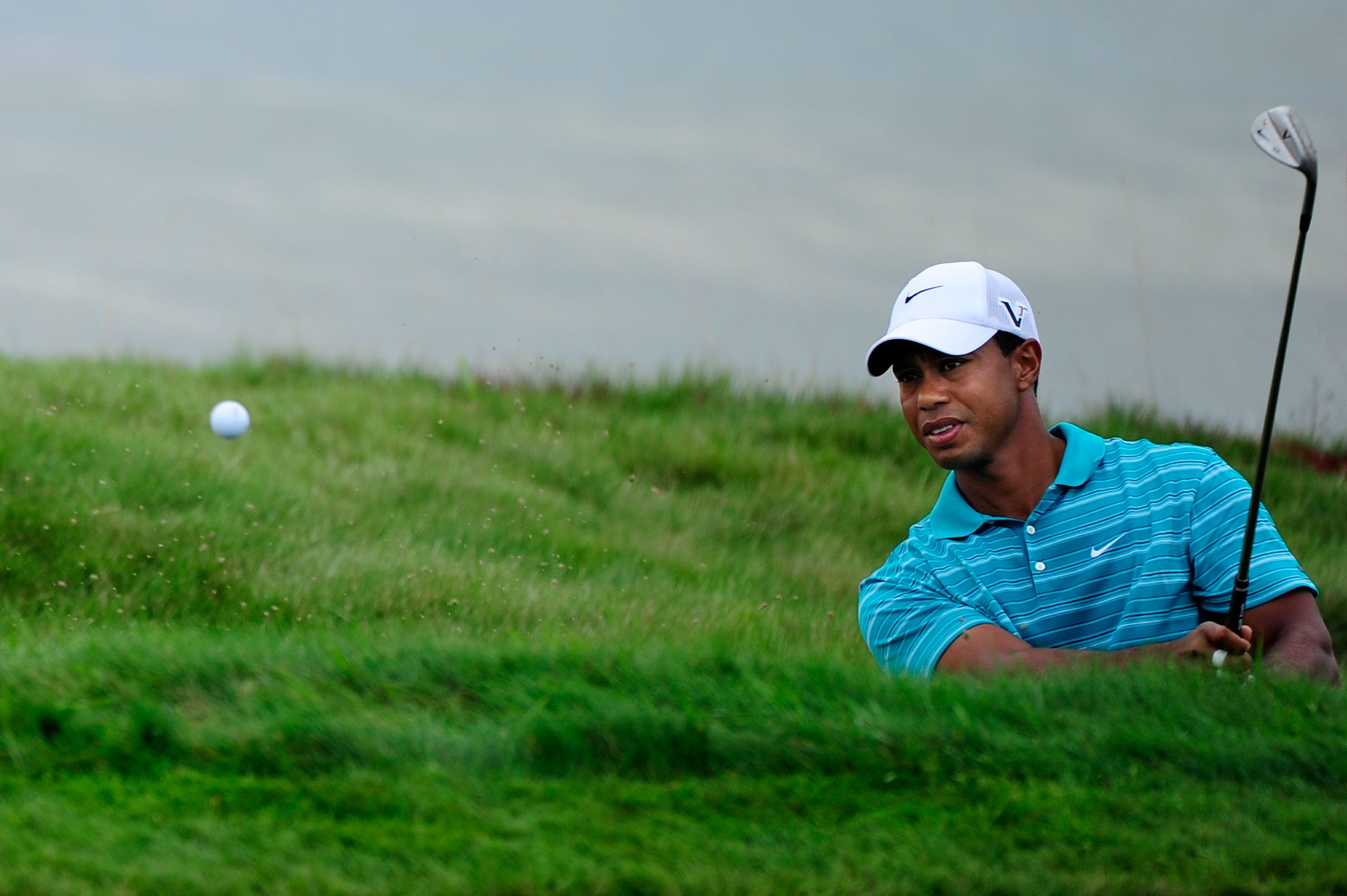 KOHLER, WI - AUGUST 14: Tiger Woods plays a bunker shot on the eighth hole during the continuation of the second round of the 92nd PGA Championship on the Straits Course at Whistling Straits on August 14, 2010 in Kohler, Wisconsin. (Photo by Stuart Fran KOHLER, WI - AUGUST 14: Tiger Woods plays a bunker shot on the eighth hole during the continuation of the second round of the 92nd PGA Championship on the Straits Course at Whistling Straits on August 14, 2010 in Kohler, Wisconsin. (Photo by Stuart Fran