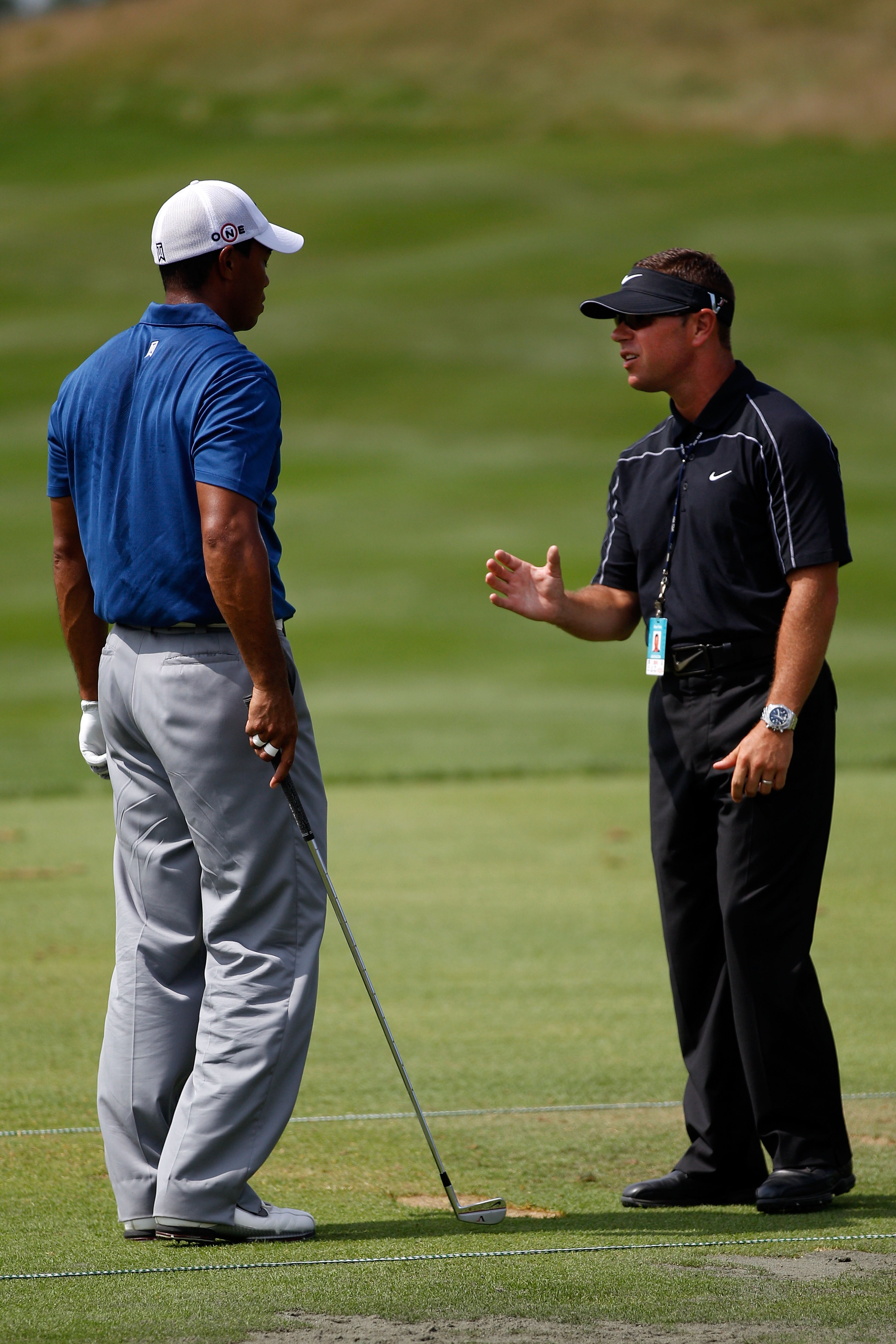 KOHLER, WI - AUGUST 14:  Tiger Woods works with golf instructor Sean Foley on the practice ground prior to the start of the third round of the 92nd PGA Championship on the Straits Course at Whistling Straits on August 14, 2010 in Kohler, Wisconsin.  (Phot