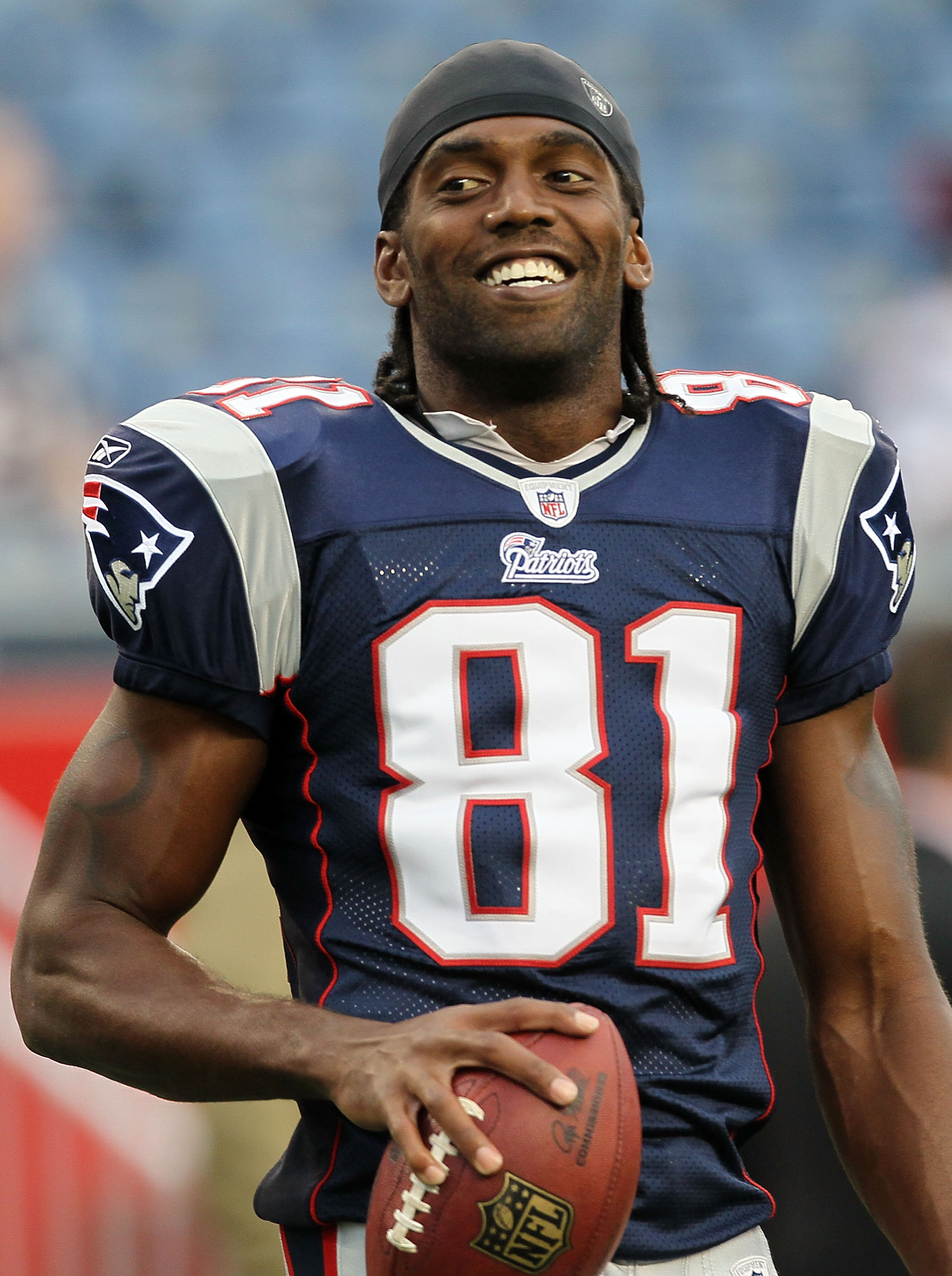 FOXBORO, MA - AUGUST 12: Randy Moss #81 of the New England Patriots holds the football before the preseason game against the New Orleans Saints at Gillette Stadium on August 12, 2010 in Foxboro, Massachusetts. (Photo by Jim Rogash/Getty Images)