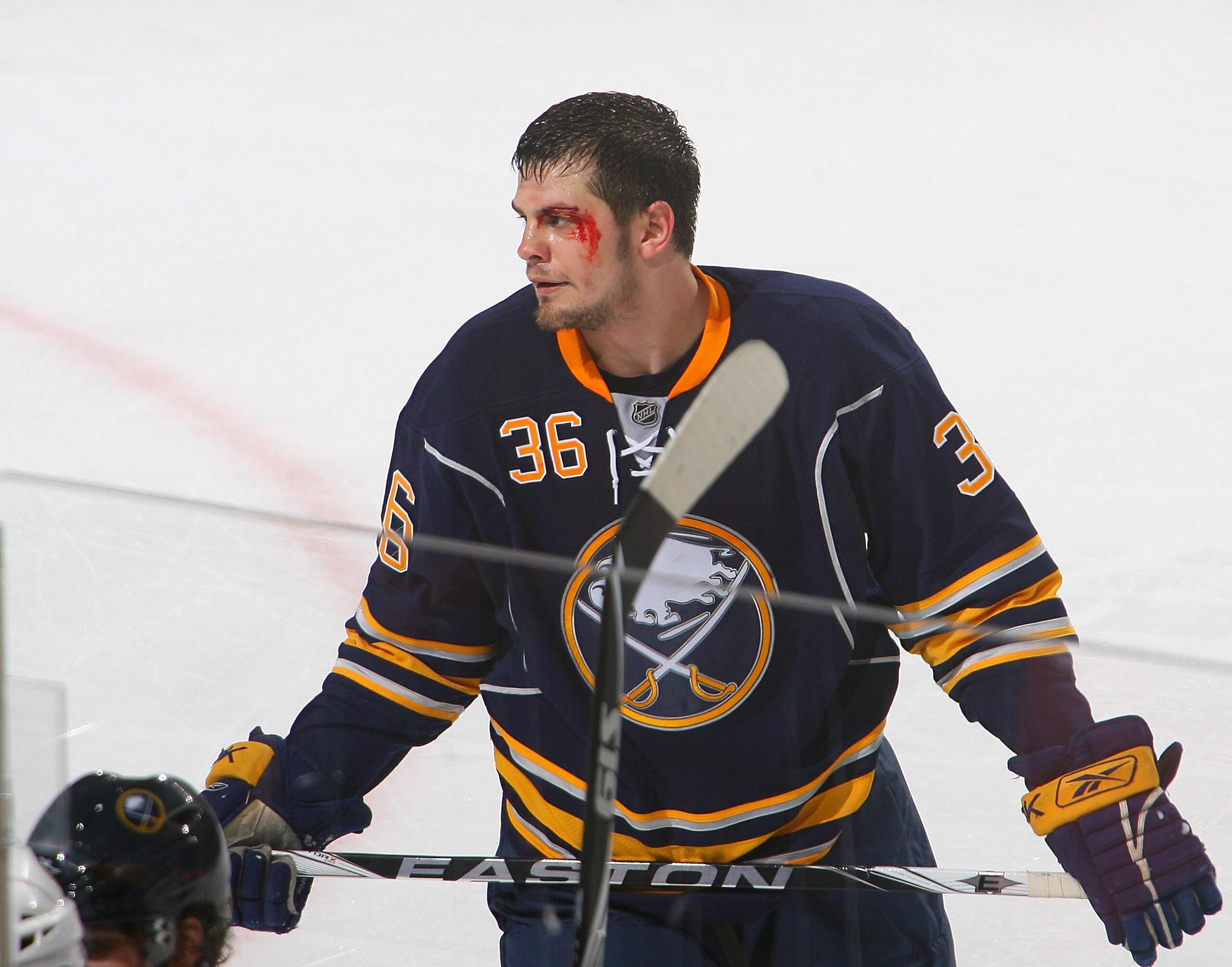 BUFFALO, NY - APRIL 15: Patrick Kaleta #36 of the Buffalo Sabres stands on the ice after being checked into the boards against the Boston Bruins in Game One of the Eastern Conference Quarterfinals during the 2010 NHL Stanley Cup Playoffs at HSBC Arena on