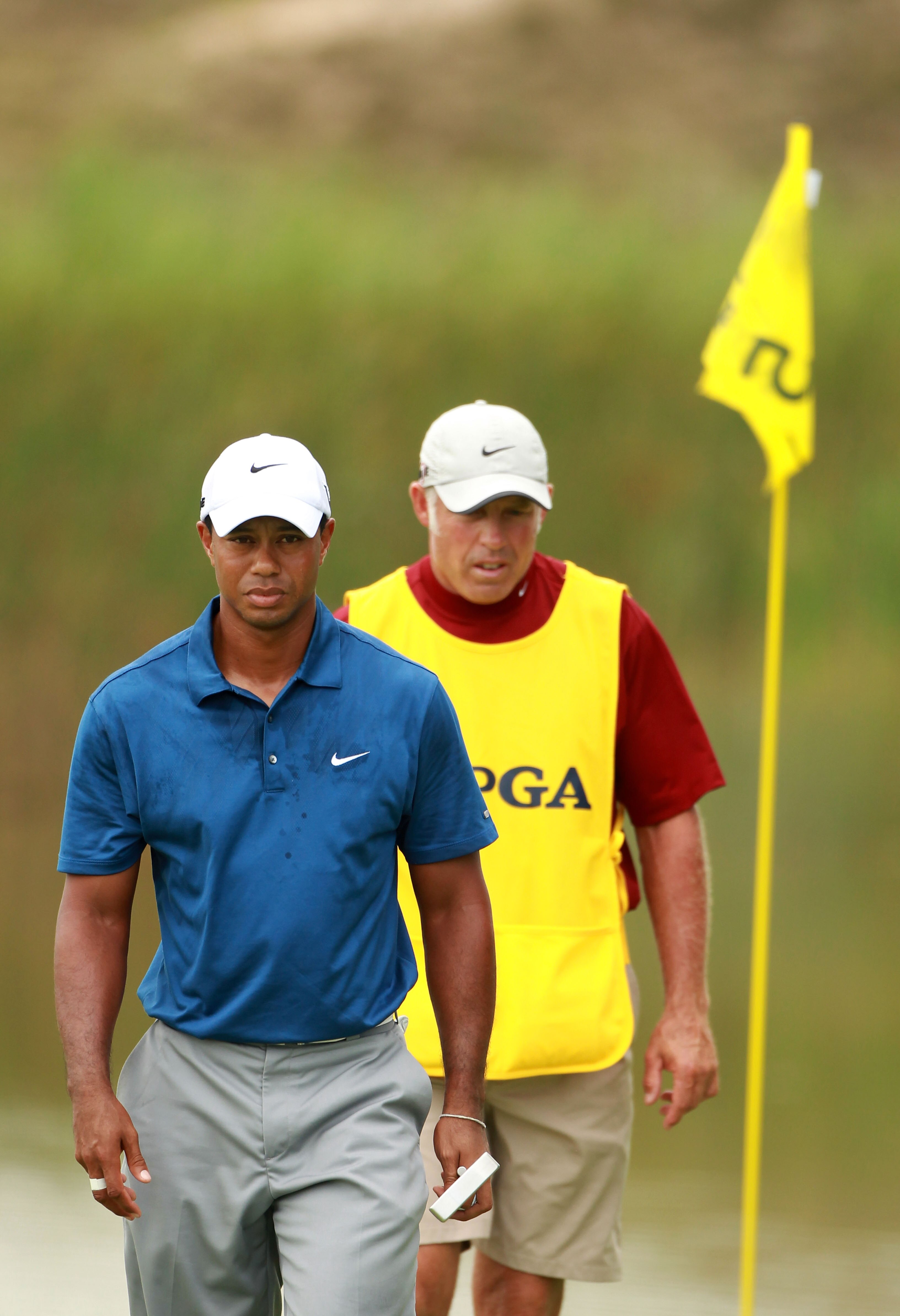 KOHLER, WI - AUGUST 14:  Tiger Woods walks off the fifth green with his caddie Steve Williams during the third round of the 92nd PGA Championship on the Straits Course at Whistling Straits on August 14, 2010 in Kohler, Wisconsin.  (Photo by Andrew Redingt
