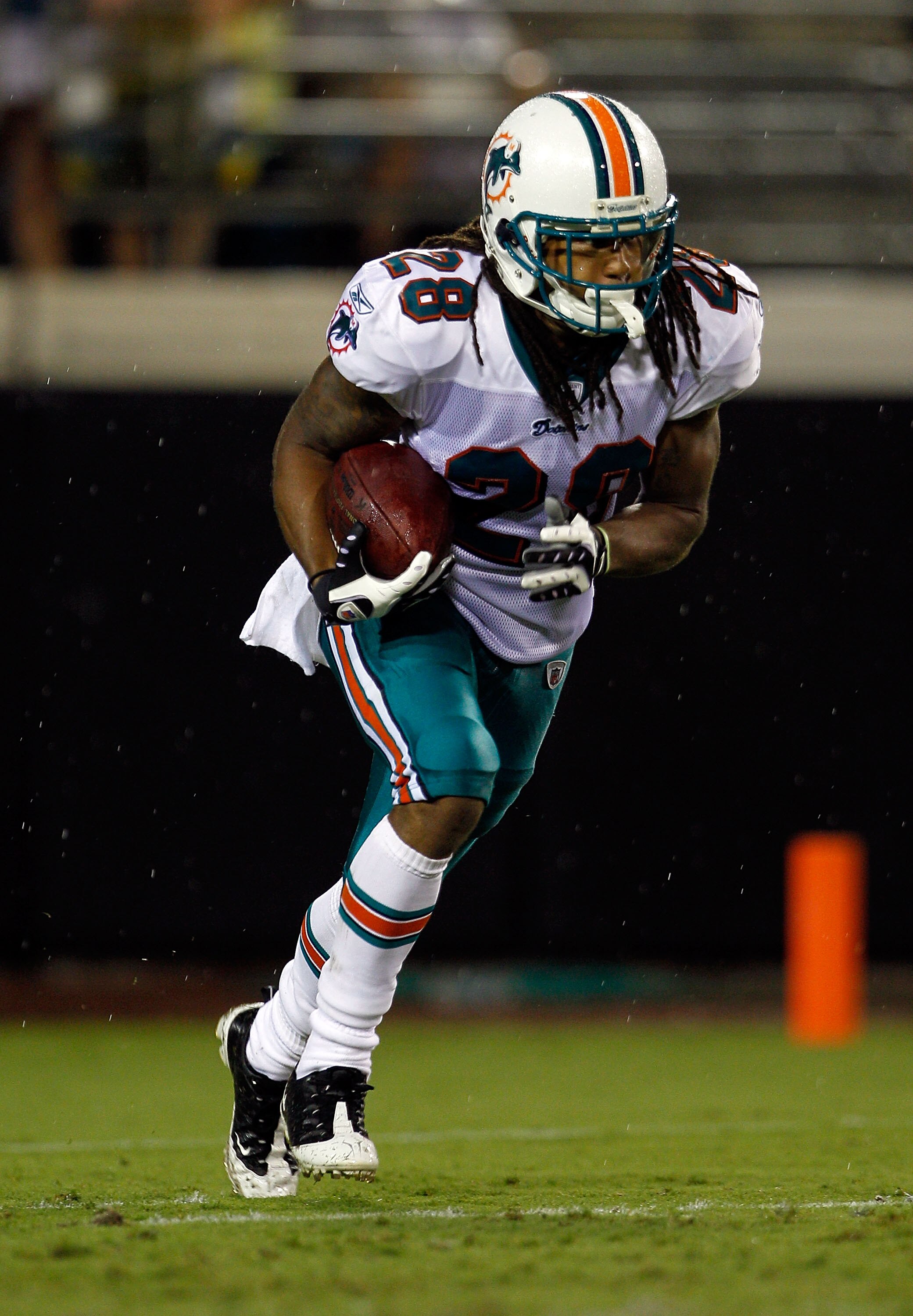 JACKSONVILLE, FL - AUGUST 21:  Nolan Carroll #28 of the Miami Dolphins runs during a preseason game against the Jacksonville Jaguars at EverBank Field on August 21, 2010 in Jacksonville, Florida.  (Photo by Sam Greenwood/Getty Images)