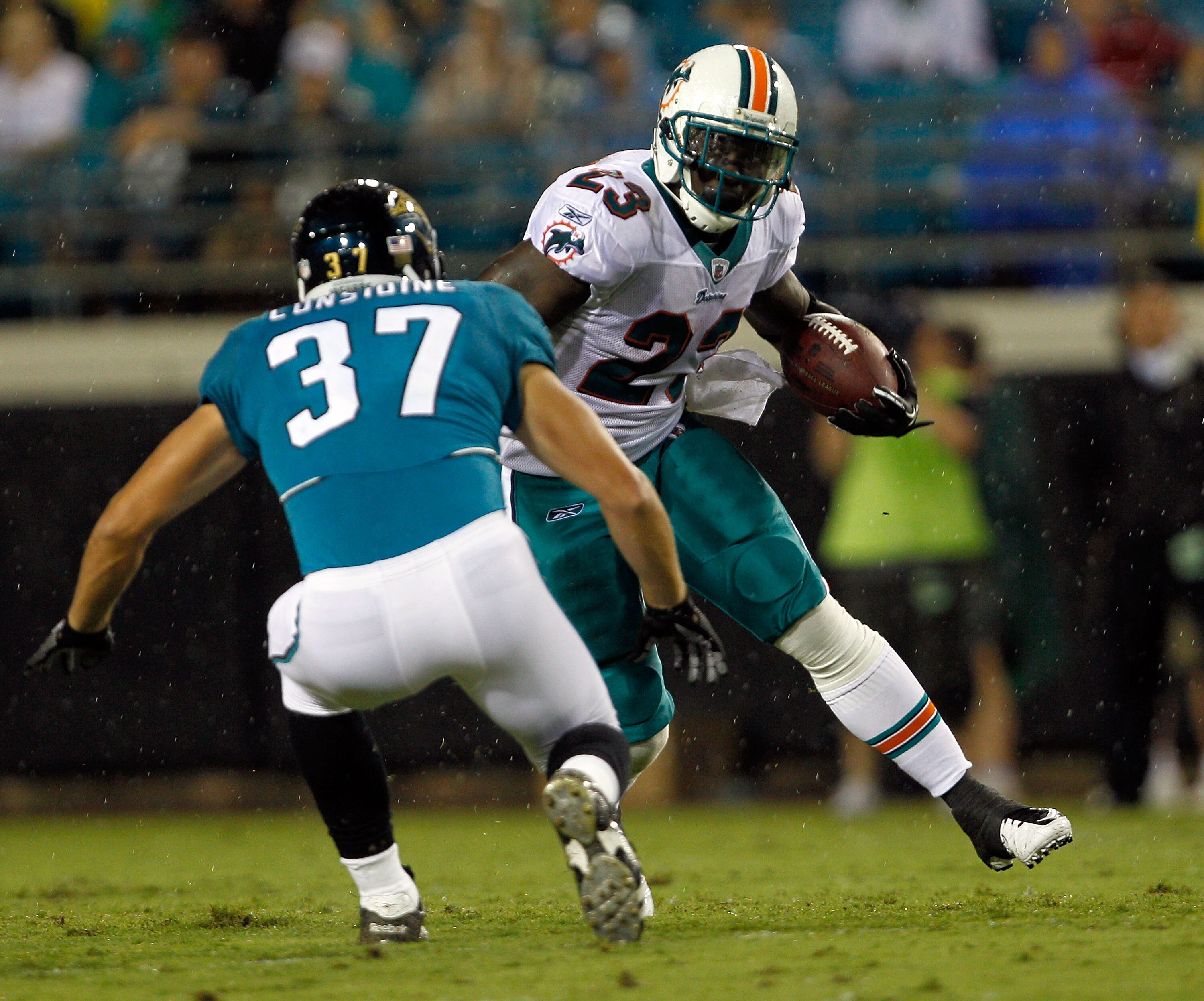 JACKSONVILLE, FL - AUGUST 21:  Ronnie Brown #23 of the Miami Dolphins attempts to run past Sean Considine #37 of the Jacksonville Jaguars during the preseason game at EverBank Field on August 21, 2010 in Jacksonville, Florida.  (Photo by Sam Greenwood/Get