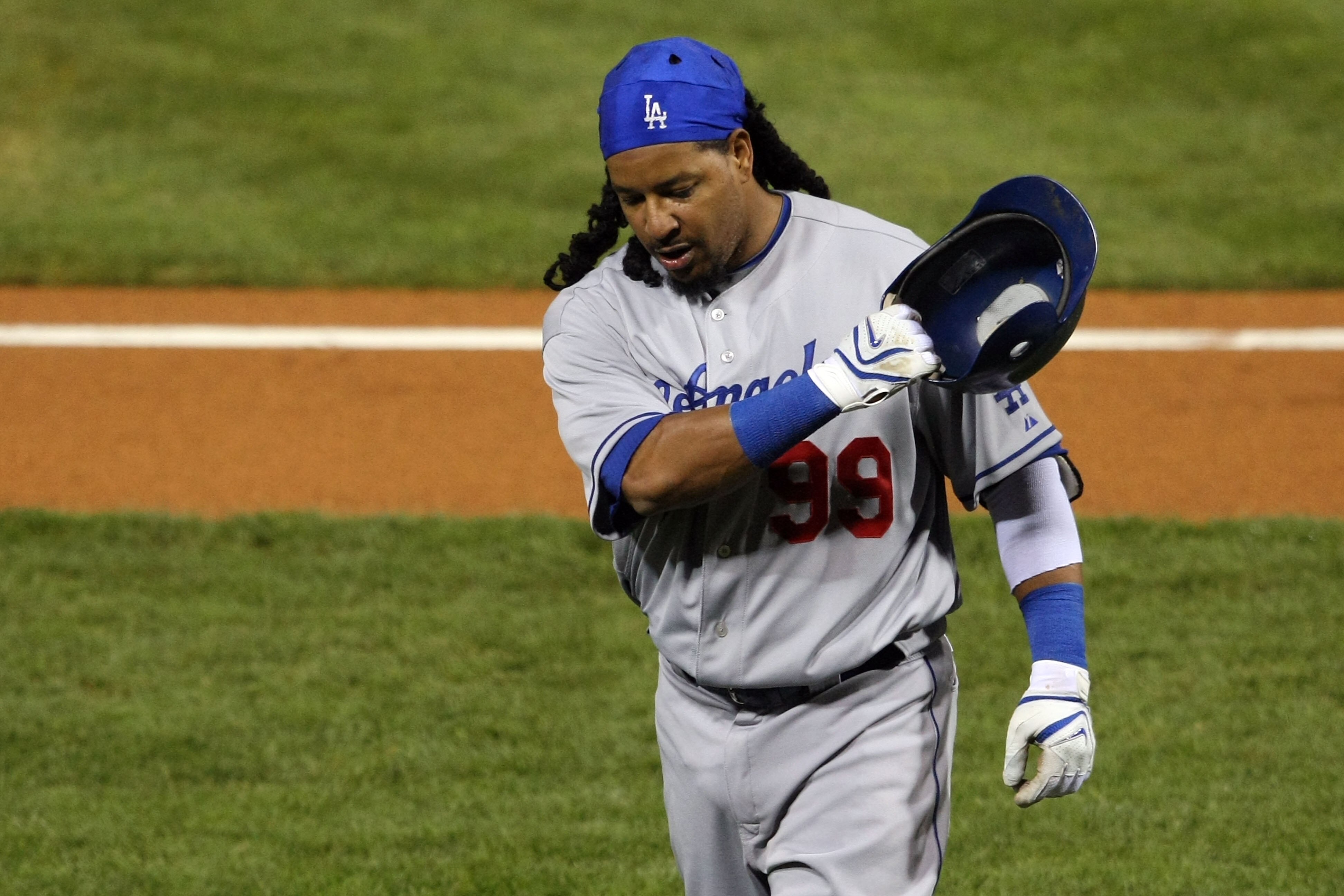 PHILADELPHIA - OCTOBER 21:  Manny Rameriz #99 of the Los Angeles Dodgers walks back to the dugout walks back to the dugout after striking out against the Philadelphia Phillies in Game Five of the NLCS during the 2009 MLB Playoffs at Citizens Bank Park on