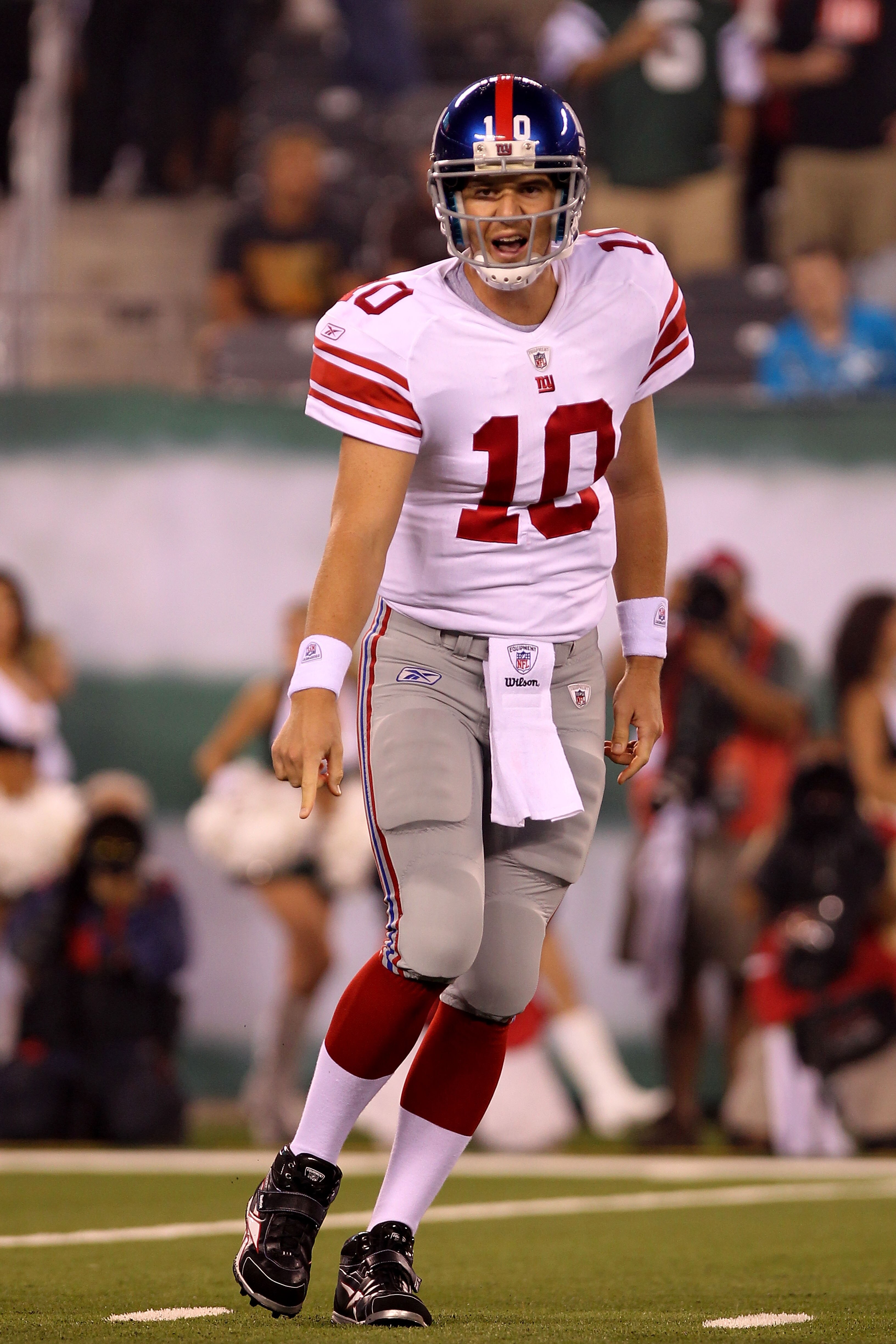 EAST RUTHERFORD, NJ - AUGUST 16:  Eli Manning #10 of the New York Giants points to the ground in the first quarter during their game against the New York Jets at New Meadowlands Stadium on August 16, 2010 in East Rutherford, New Jersey.  (Photo by Nick La