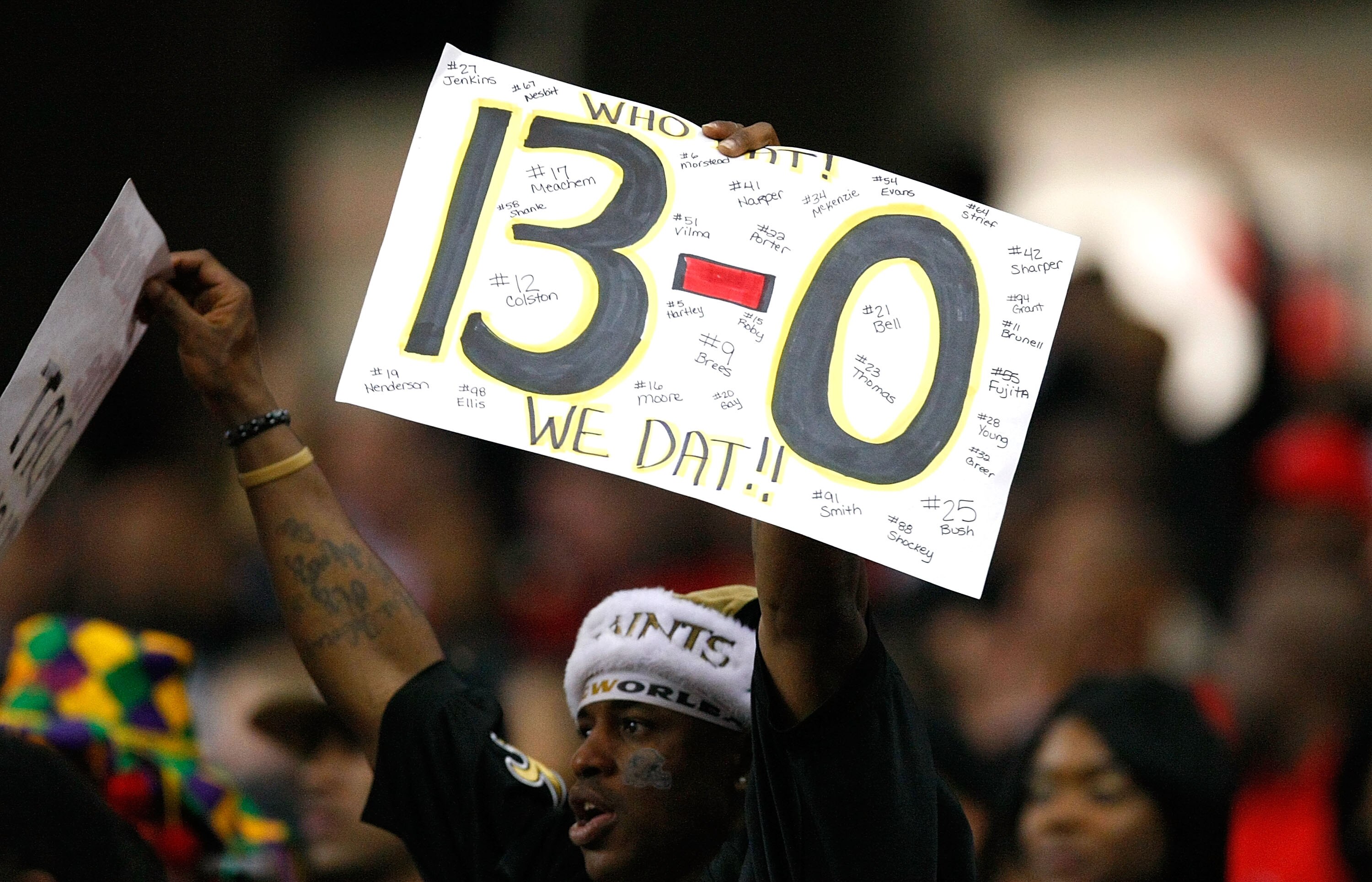 ATLANTA - DECEMBER 13:  A fan of the New Orleans Saints holds up a sign with '13-0' written on it during the game against the Atlanta Falcons at Georgia Dome on December 13, 2009 in Atlanta, Georgia. The Saints won 26-23. (Photo by Kevin C. Cox/Getty Imag