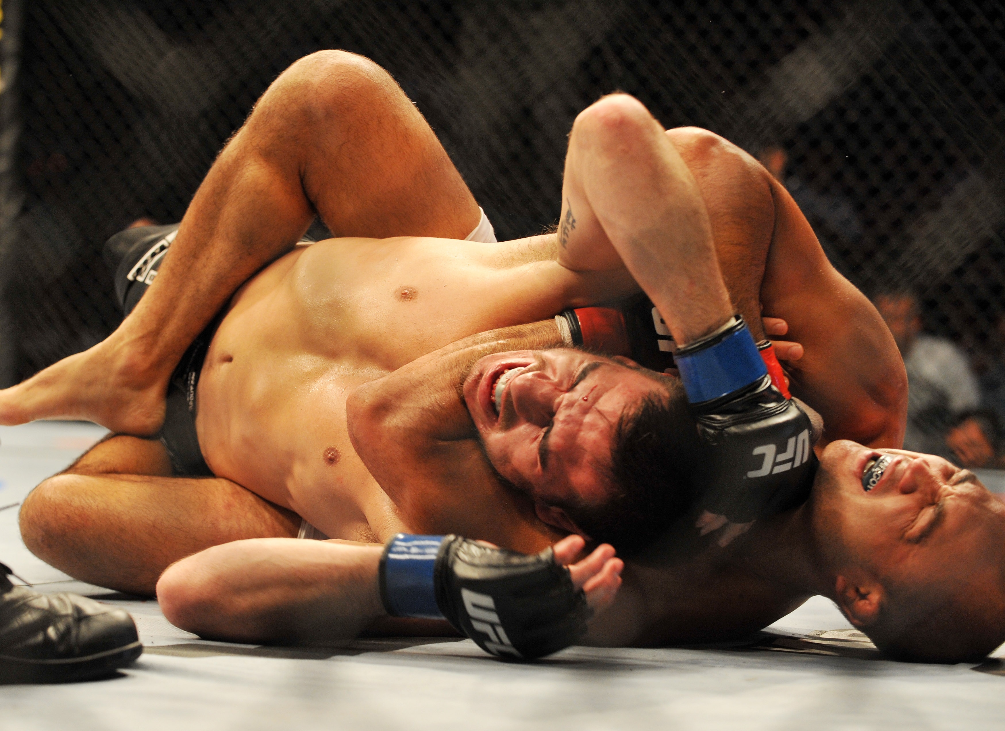 PHILADELPHIA - AUGUST 08:   Lightweight champion BJ Penn (R) battles Kenny Florian during their lightweight championship title bout at UFC 101: Declaration at the Wachovia Center on August 8, 2009 in Philadelphia, Pennsylvania.  (Photo by Jon Kopaloff/Get