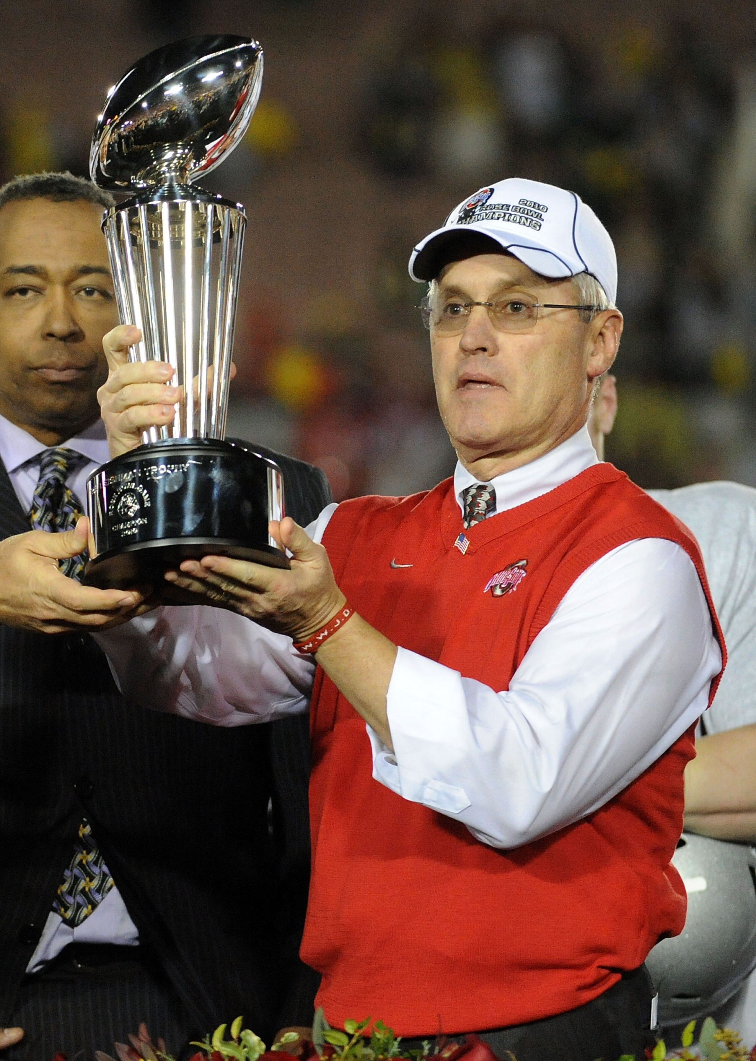 PASADENA, CA - JANUARY 01: Head coach Jim Tressel of the Ohio State Buckeyes celebrates with the Rose Bowl championship trophy after the Buckeyes 26-17 win in the 96th Rose Bowl game over the Oregon Ducks on January 1, 2010 in Pasadena, California. (Pho PASADENA, CA - JANUARY 01: Head coach Jim Tressel of the Ohio State Buckeyes celebrates with the Rose Bowl championship trophy after the Buckeyes 26-17 win in the 96th Rose Bowl game over the Oregon Ducks on January 1, 2010 in Pasadena, California. (Pho