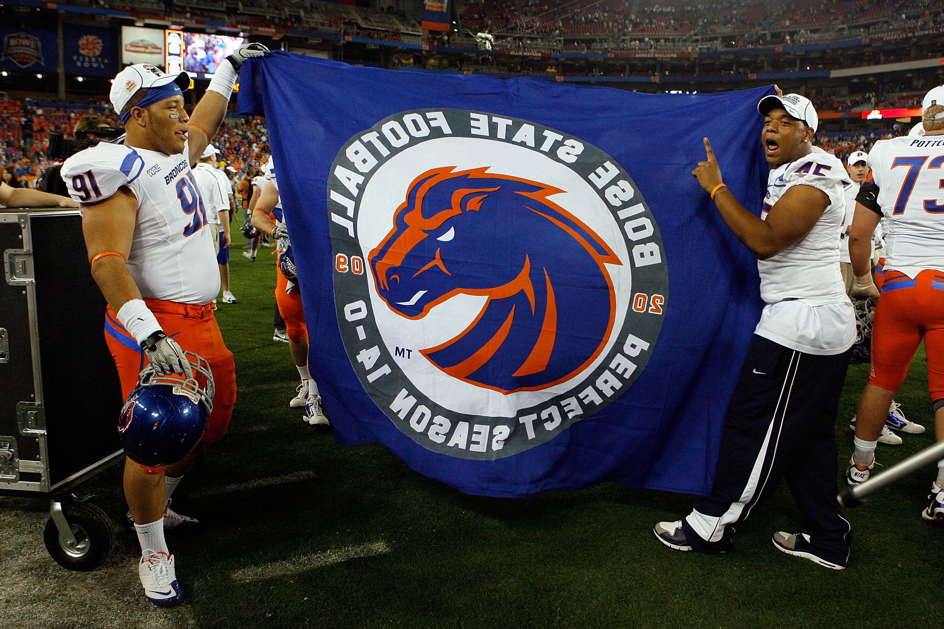 GLENDALE, AZ - JANUARY 04:  Chuck Hayes #91 and Daron Mackey #45 of the Boise State Broncos celebrate after defeating the TCU Horned Frogs 17-10 during the Tostitos Fiesta Bowl at the Universtity of Phoenix Stadium on January 4, 2010 in Glendale, Arizona.