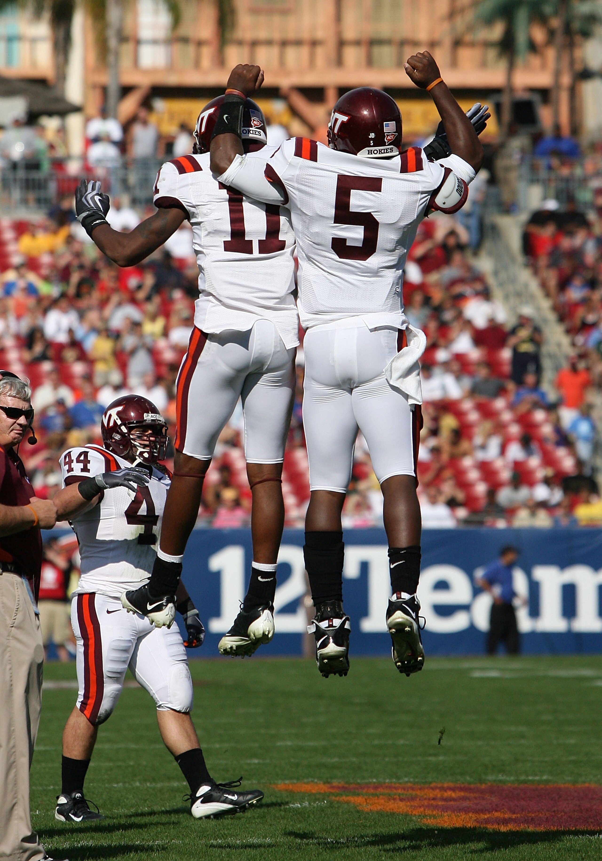 TAMPA, FL - DECEMBER 06:  Quarterback Tyrod Taylor #5 and flanker Dyrell Roberts #11 of the Virginia Tech Hokies celebrate after Taylor's touchdown run in the first quarter against the Boston College Eagles in the 2008 ACC Football Championship game at th
