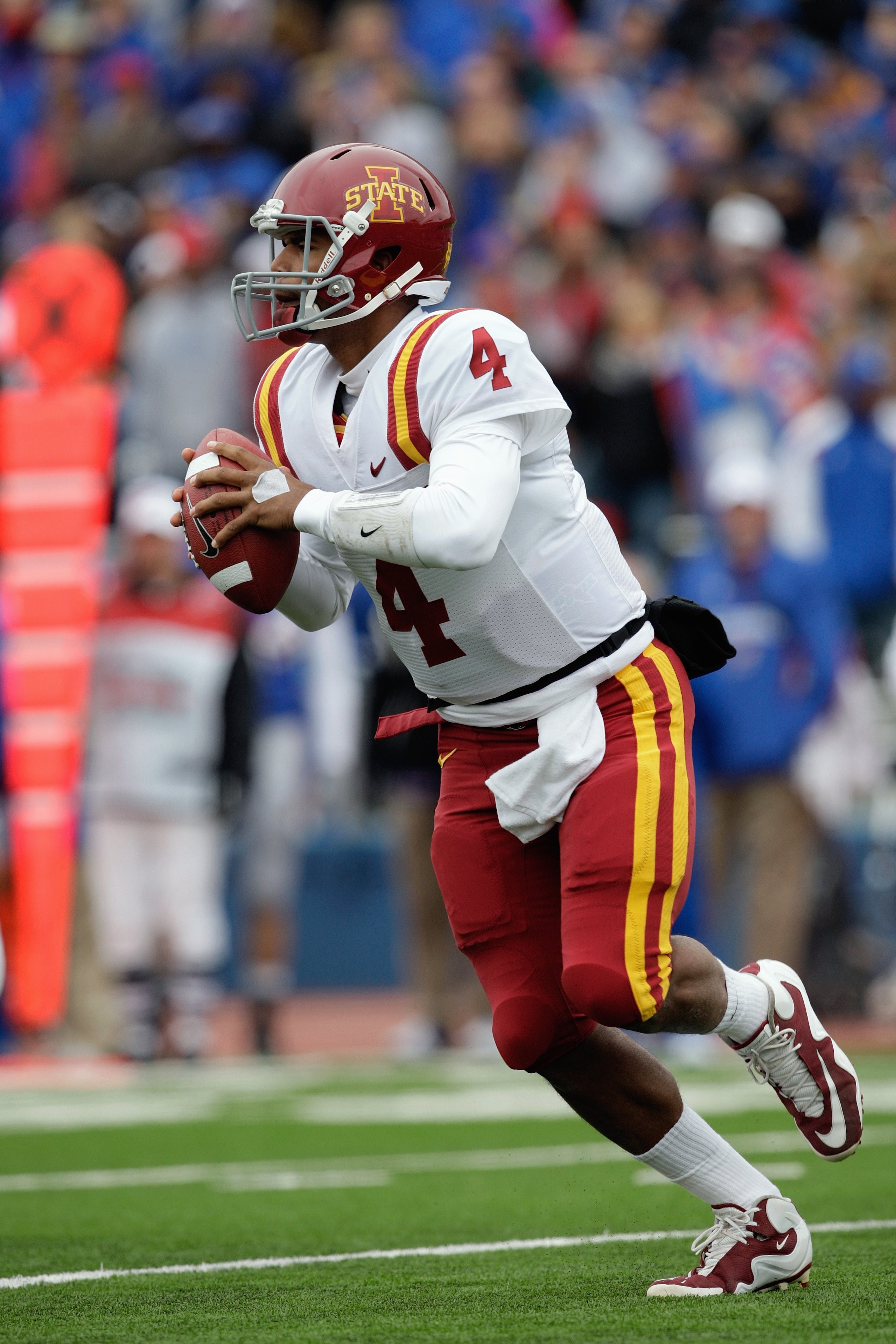 LAWRENCE, KS - OCTOBER 10:  Austen Arnaud #4 of the Iowa State Cyclones runs with the ball during the game against the Kansas Jayhawks on October 10, 2009 at Memorial Stadium in Lawrence, Kansas. (Photo by Jamie Squire/Getty Images)