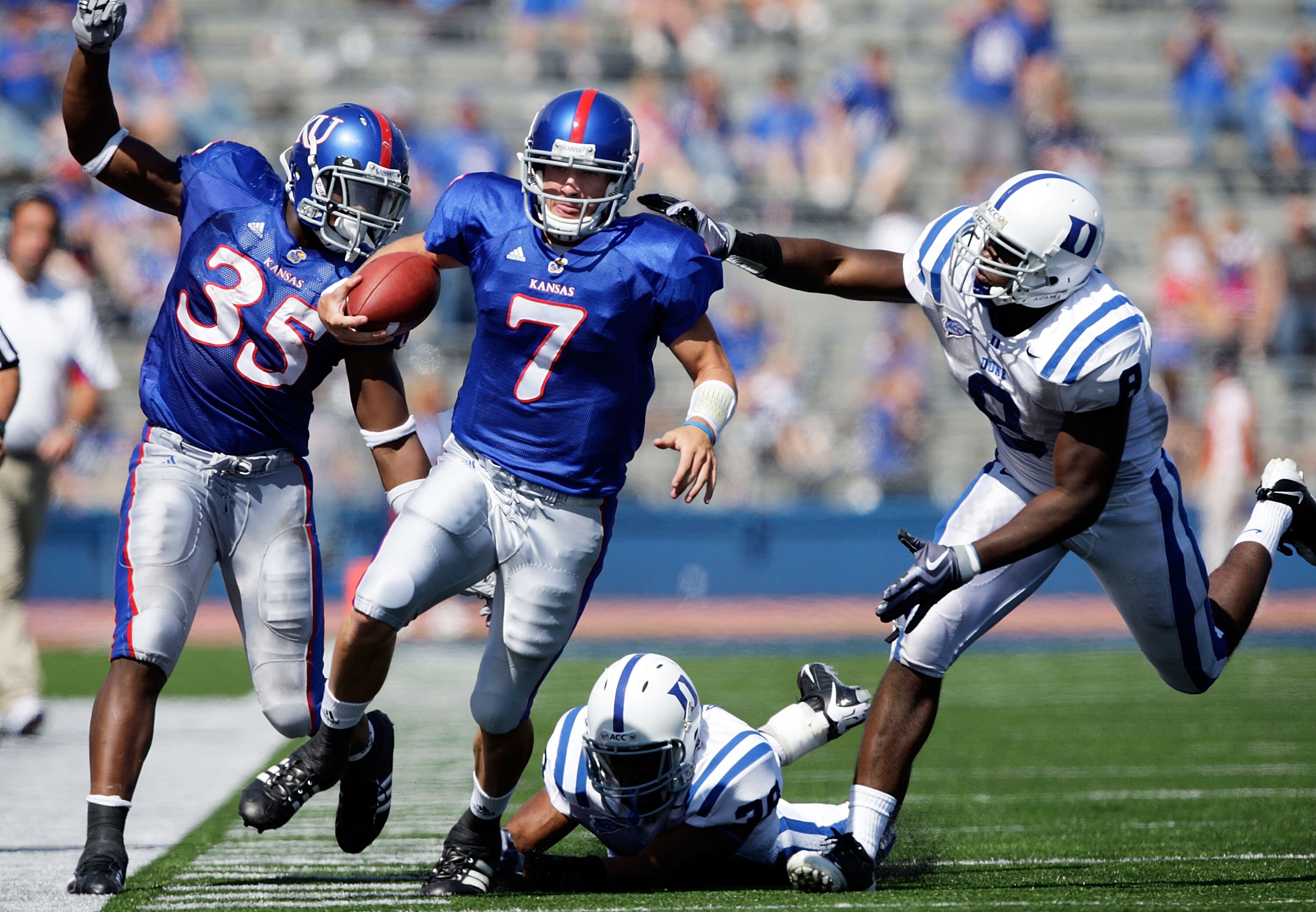 LAWRENCE, KS - SEPTEMBER 19:  Quarterback Kale Pick #7 of the Kansas Jayhawks carries the ball upfield  during the game against the Duke Blue Devils on Kivisto Field at Memorial Stadium on September 19, 2009 in Lawrence, Kansas.  (Photo by Jamie Squire/Ge