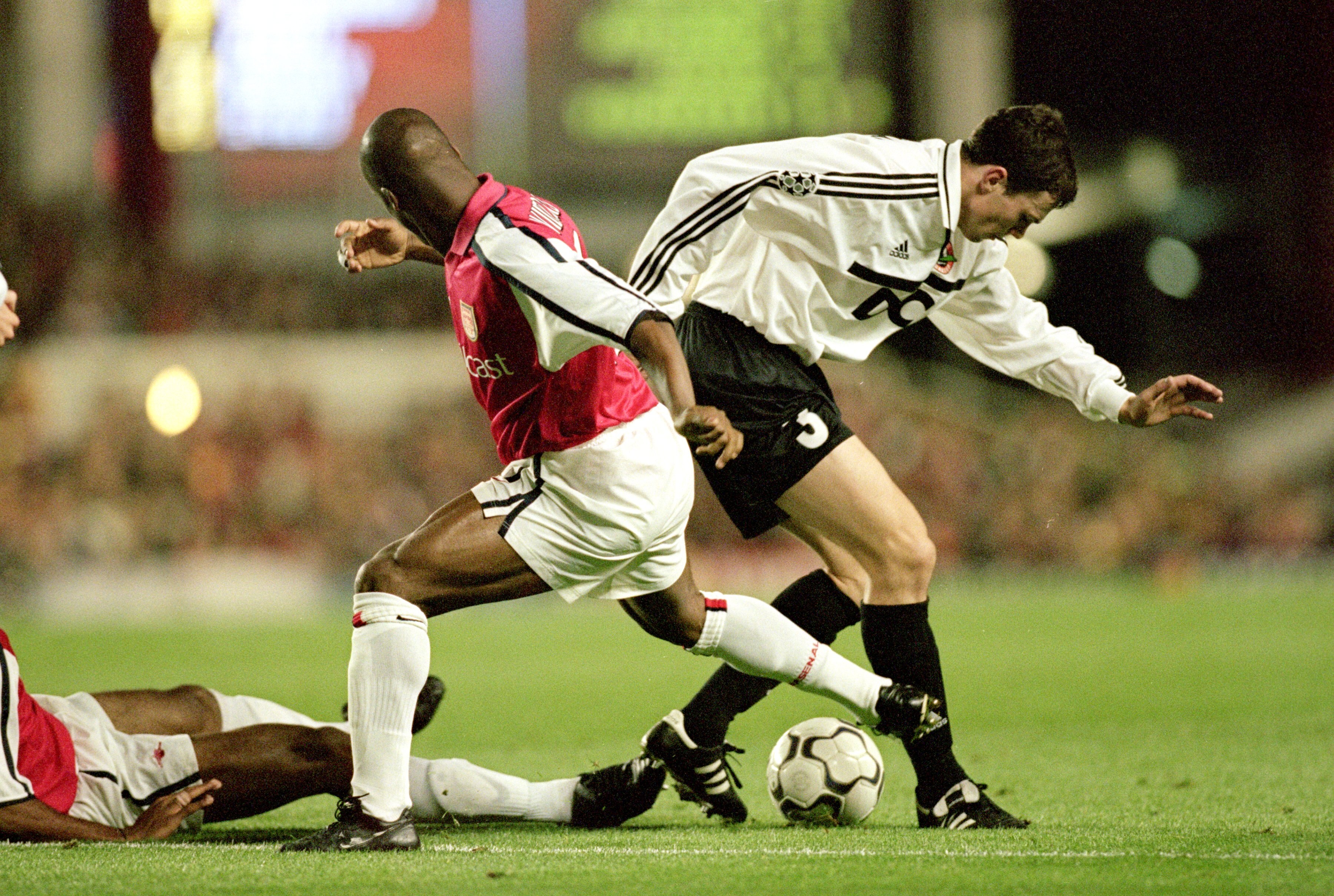 20 Sep 2000:  Dainius Gleveckas (#3) of Shakhtar Donetsk is challenged by Sylvain Wiltord of Arsenal during the UEFA Champions League match at Highbury in London.  Arsenal won the match 3-2. \ Mandatory Credit: Dave Cannon /Allsport