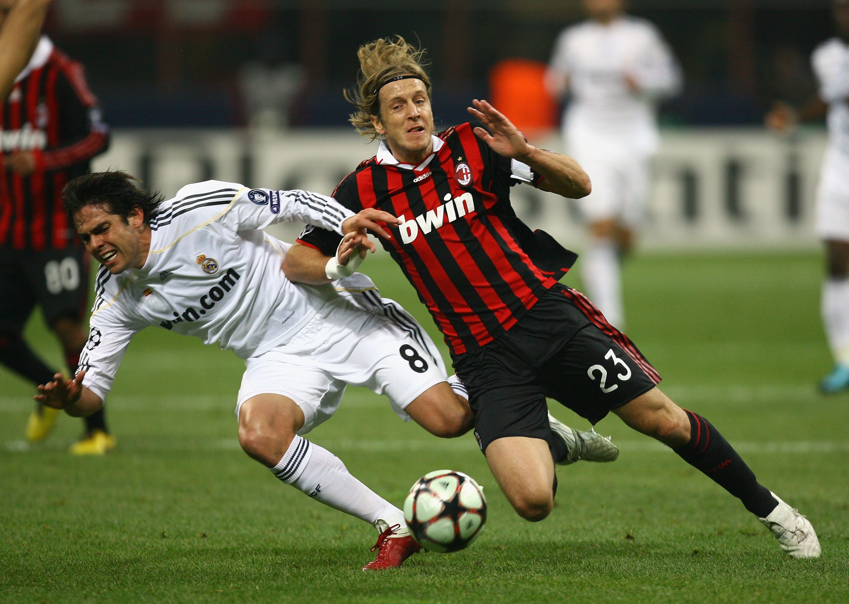 MILAN, ITALY - NOVEMBER 03:  Kaka of Real Madrid is tackled by Massimo Ambrosini of AC Milan during the UEFA Champions League Group C match between AC Milan and Real Madrid at the San Siro on November 3, 2009 in Milan, Italy.  (Photo by Alex Livesey/Getty