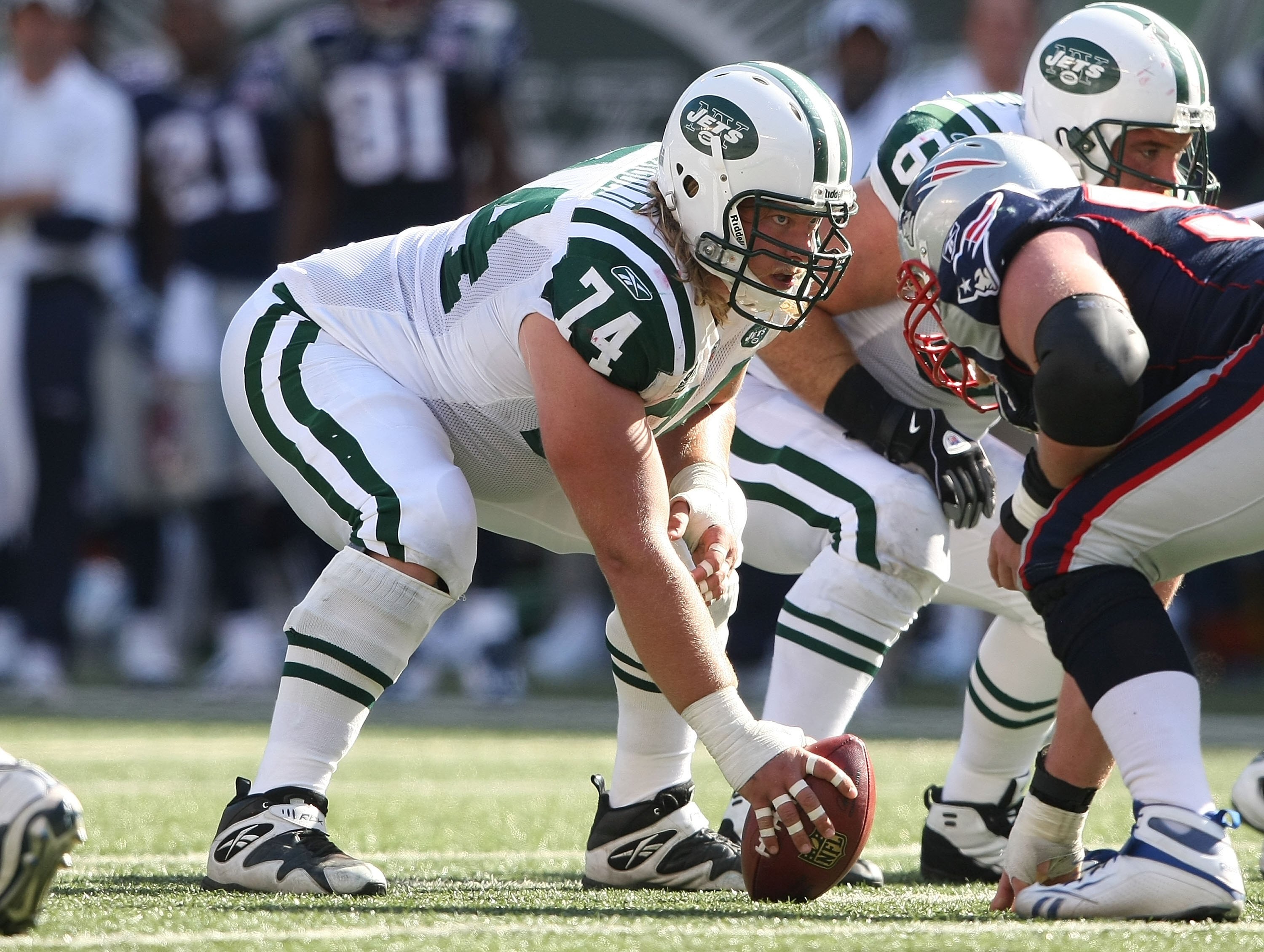 EAST RUTHERFORD, NJ - SEPTEMBER 20:  Nick Mangold #74 of the New York Jets waits to snap against the New England Patriots at Giants Stadium on September 20, 2009 in East Rutherford, New Jersey.  (Photo by Nick Laham/Getty Images)