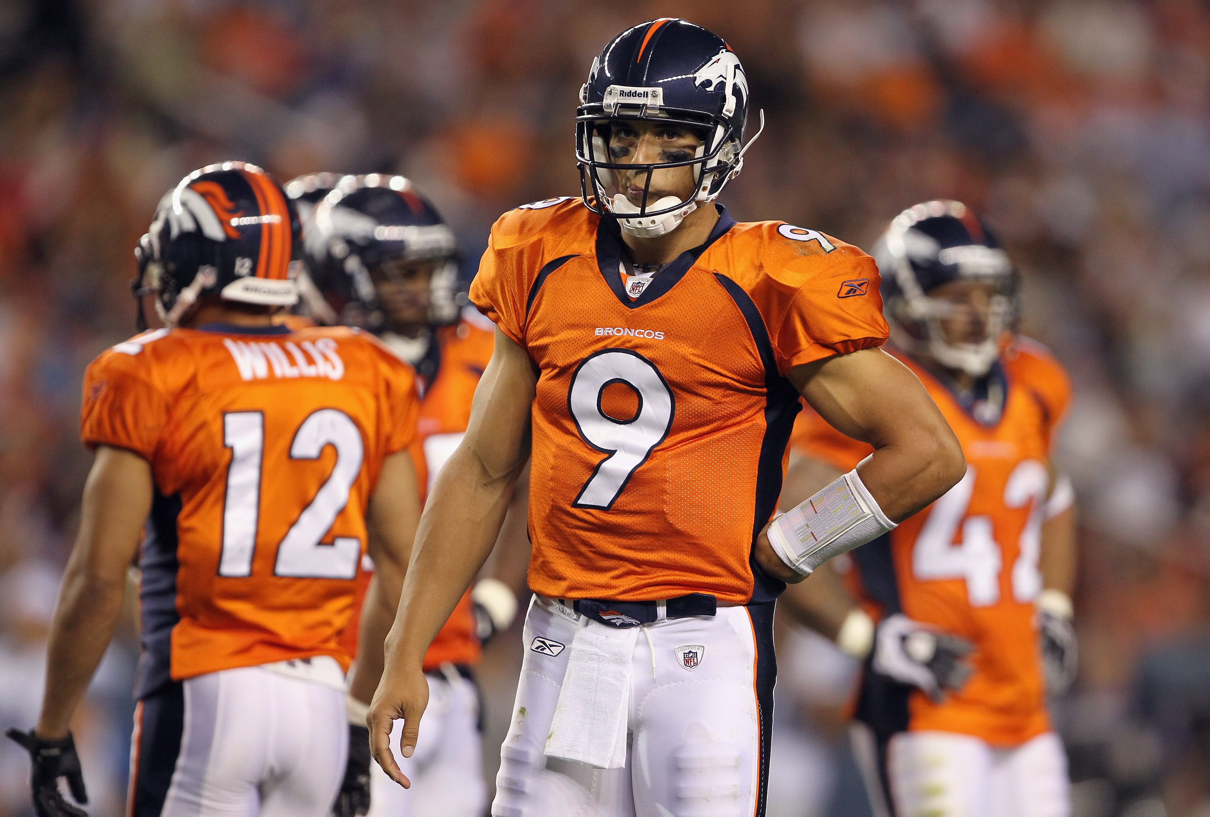 DENVER - AUGUST 21:  Quarterback Brady Quinn #9 of the Denver Broncos looks on during a break in the action against the Detroit Lions during preseason NFL action at INVESCO Field at Mile High on August 21, 2010 in Denver, Colorado. The Lions defeated the