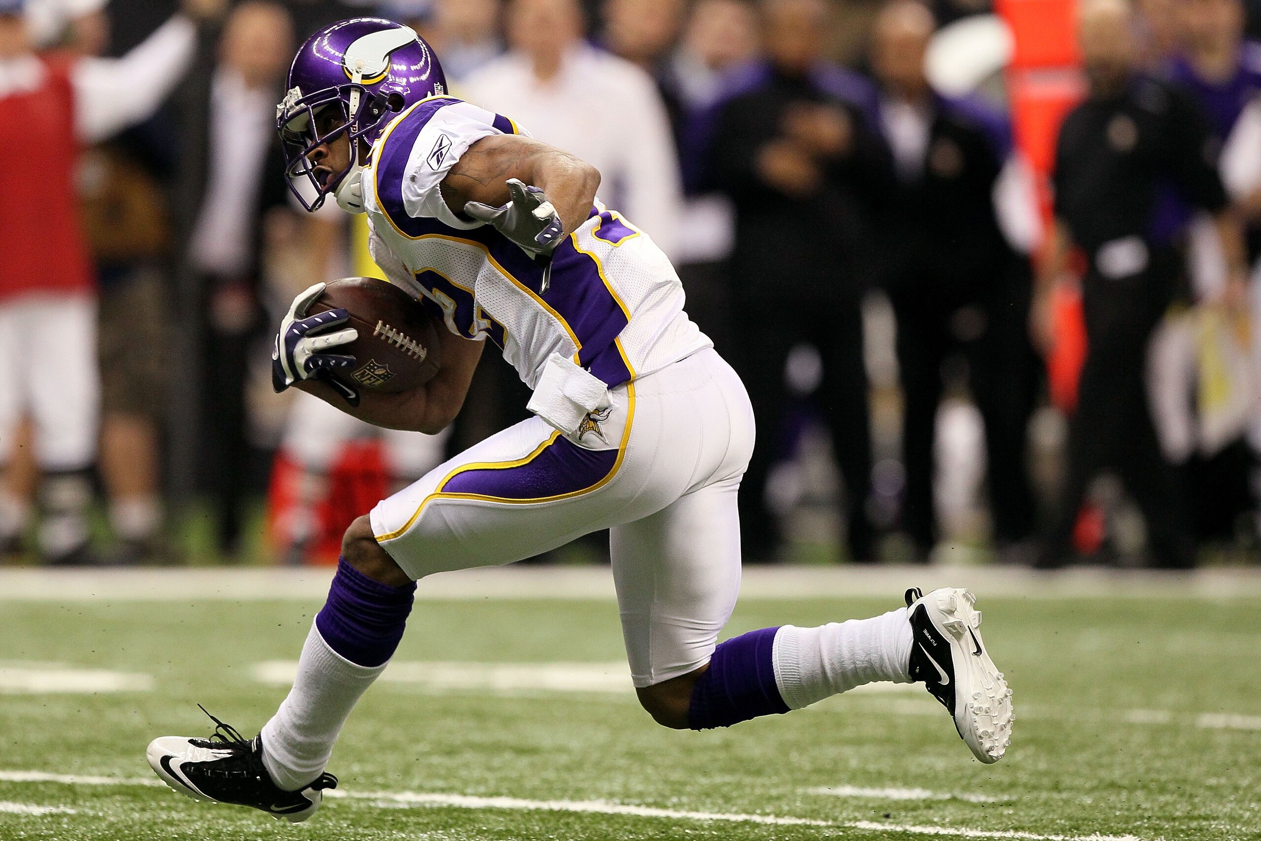 NEW ORLEANS - JANUARY 24:  Percy Harvin #12 of the Minnesota Vikings returns a punt against the New Orleans Saints during the NFC Championship Game at the Louisiana Superdome on January 24, 2010 in New Orleans, Louisiana. The Saints won 31-28 in overtime.