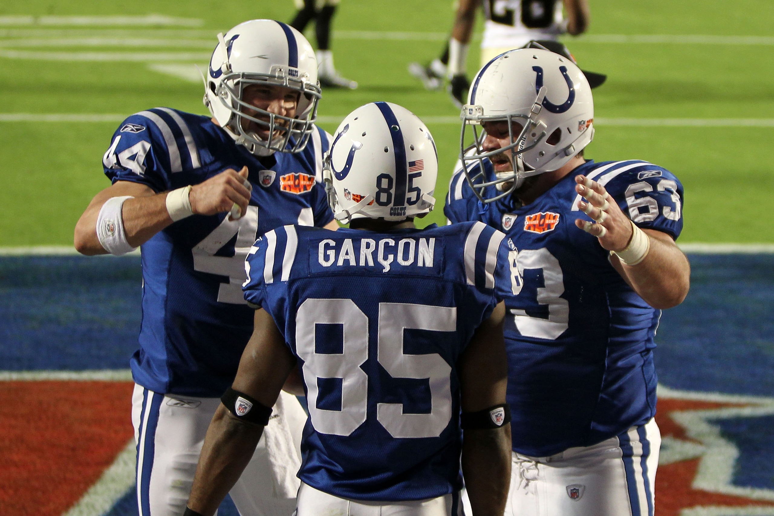 MIAMI GARDENS, FL - FEBRUARY 07:   Pierre Garcon #85 of the Indianapolis Colts celebrates after scoring a touchdown with Dallas Clark and Jeff Saturday #63 against the New Orleans Saints during Super Bowl XLIV on February 7, 2010 at Sun Life Stadium in Mi