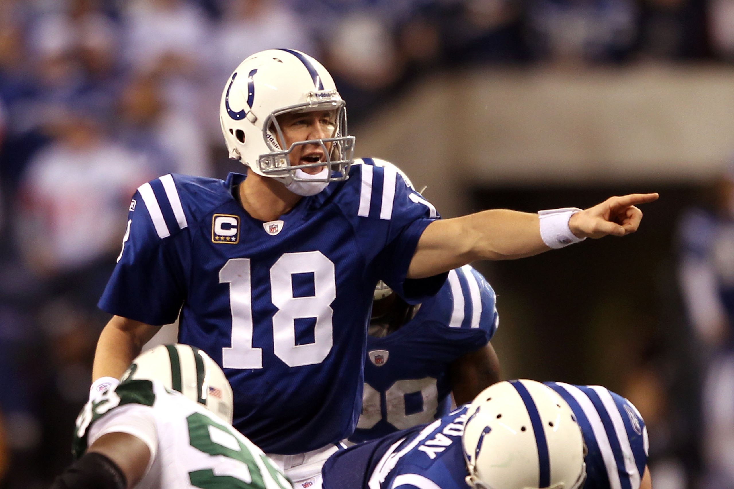 INDIANAPOLIS - JANUARY 24:  Quarterback Peyton Manning #18 of the Indianapolis Colts under center during the second half against the New York Jets during the AFC Championship Game at Lucas Oil Stadium on January 24, 2010 in Indianapolis, Indiana. The Colt