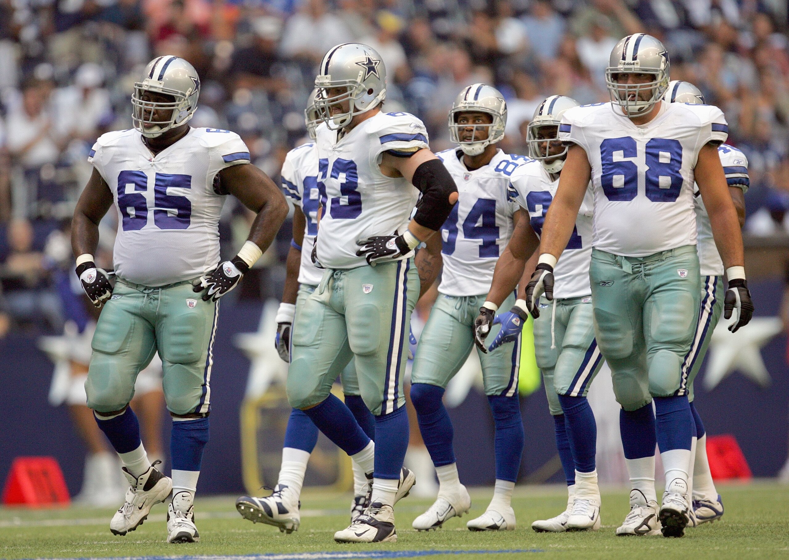 IRVING, TX - AUGUST 9:  Andre Gurode #65, Kyle Kosier #63, Doug Free #68 and Patrick Crayton #84 of the Dallas Cowboys walk to the line during the preseason game against the Indianapolis Colts at Texas Stadium on August 9, 2007 in Irving, Texas. (Photo by