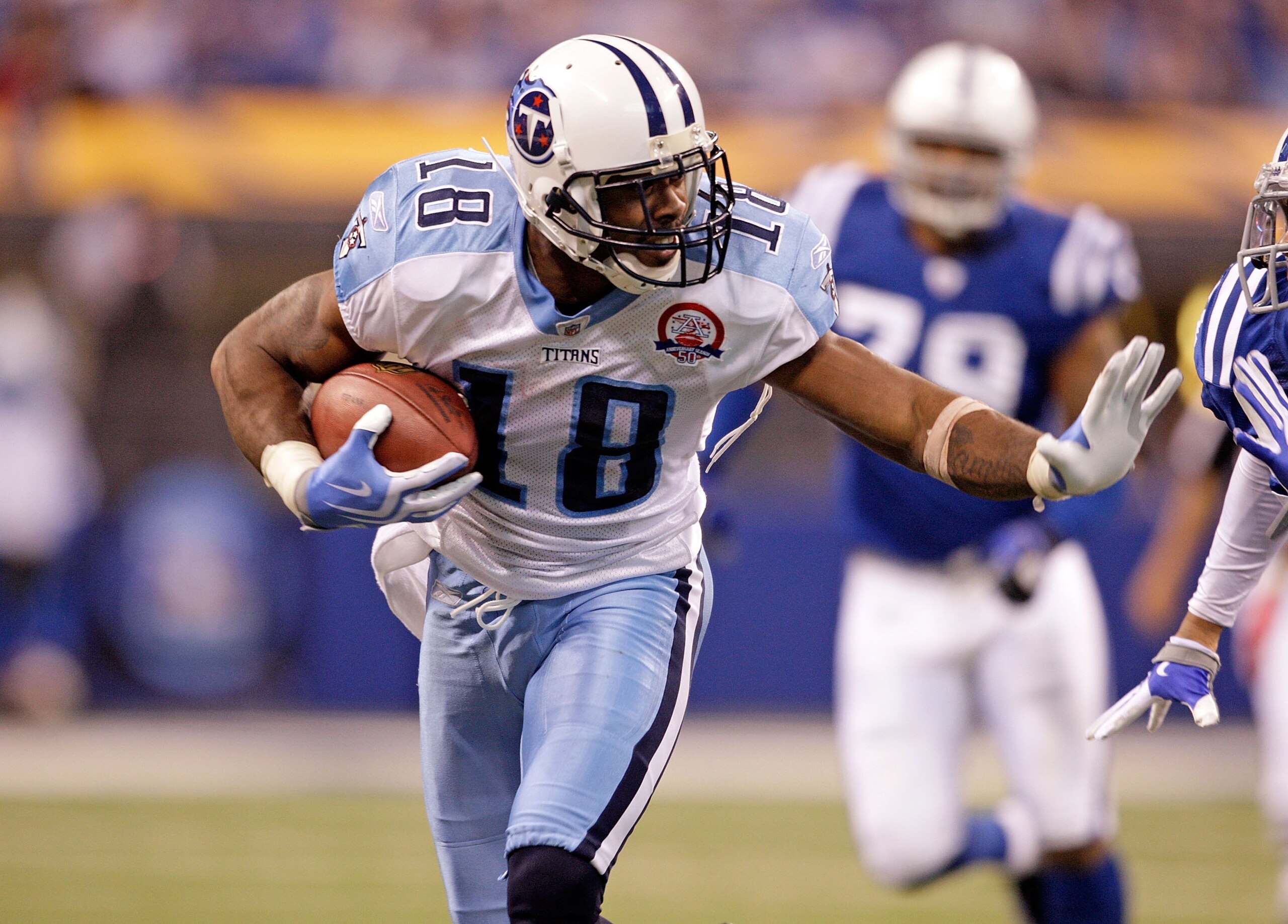 INDIANAPOLIS - DECEMBER 06:  Kenny Britt #18 of  the Tennessee Titans runs with the ball during the NFL game against the Indianapolis Colts at Lucas Oil Stadium on December 6, 2009 in Indianapolis, Indiana.  (Photo by Andy Lyons/Getty Images)