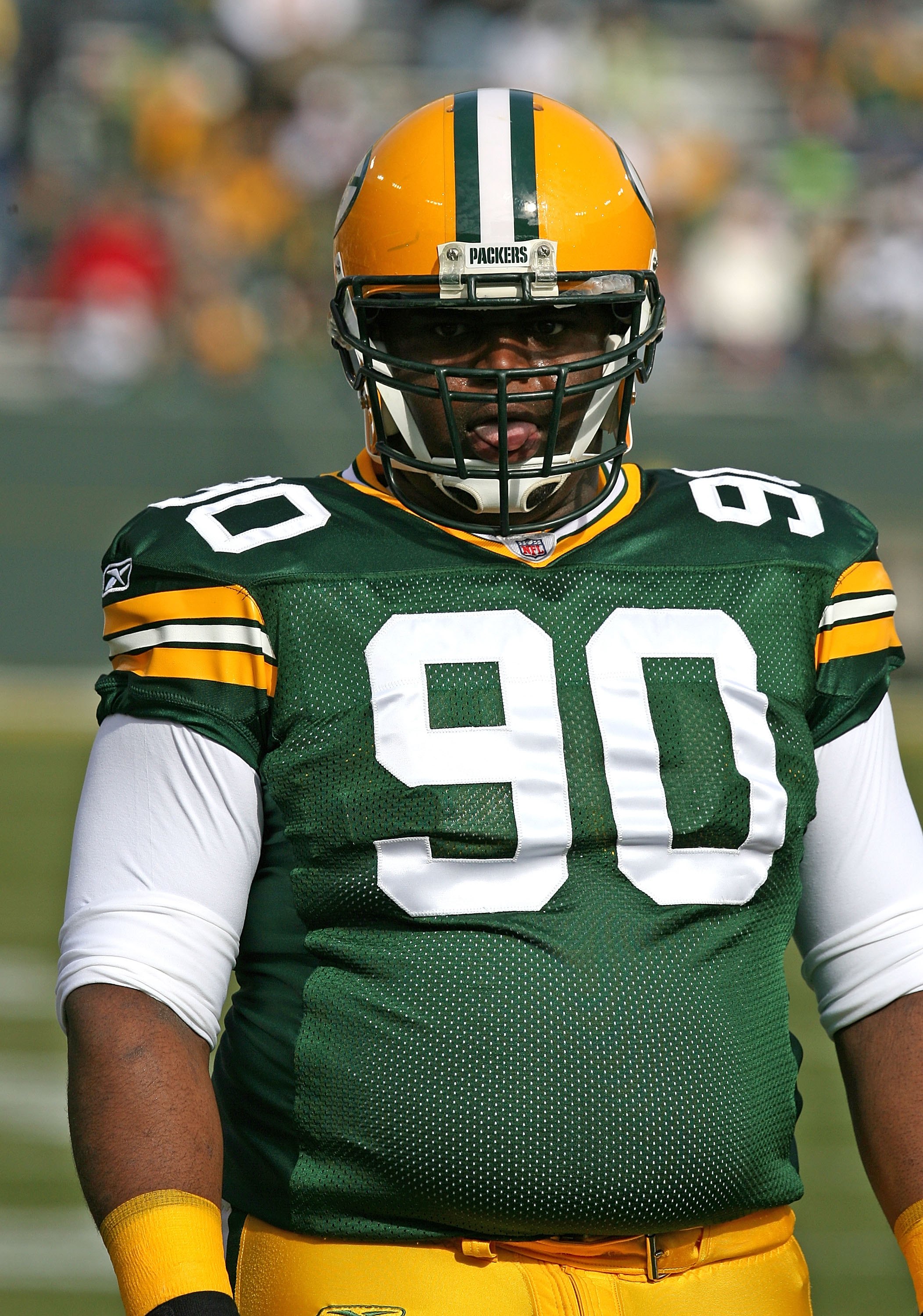 GREEN BAY, WI - OCTOBER 18: B.J. Raji #90 of the Green Bay Packers participates in warm-ups before a game against the Detroit Lions at Lambeau Field on October 18, 2009 in Green Bay, Wisconsin. The Packers defeated the Lions 26-0. (Photo by Jonathan Danie