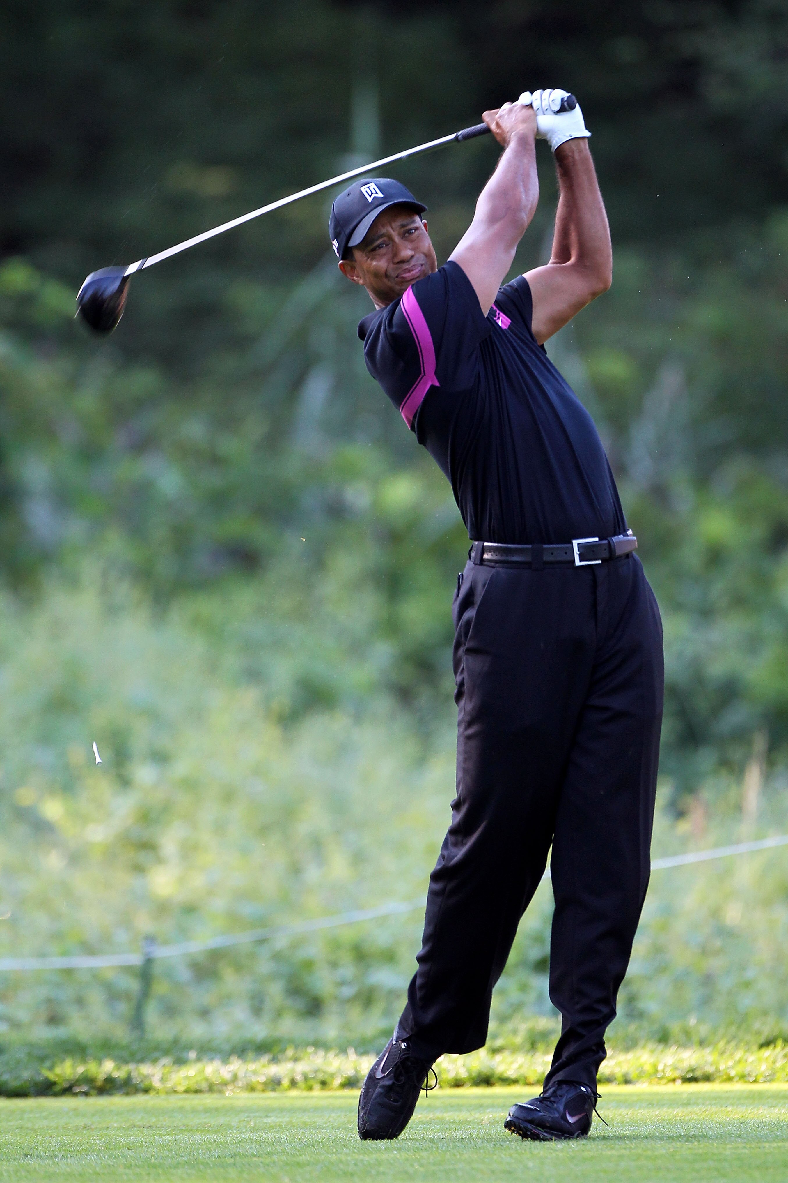 PARAMUS, NJ - AUGUST 26:  Tiger Woods watches his tee shot on the fifth hole during the first round of The Barclays at the Ridgewood Country Club on August 26, 2010 in Paramus, New Jersey.  (Photo by Hunter Martin/Getty Images)