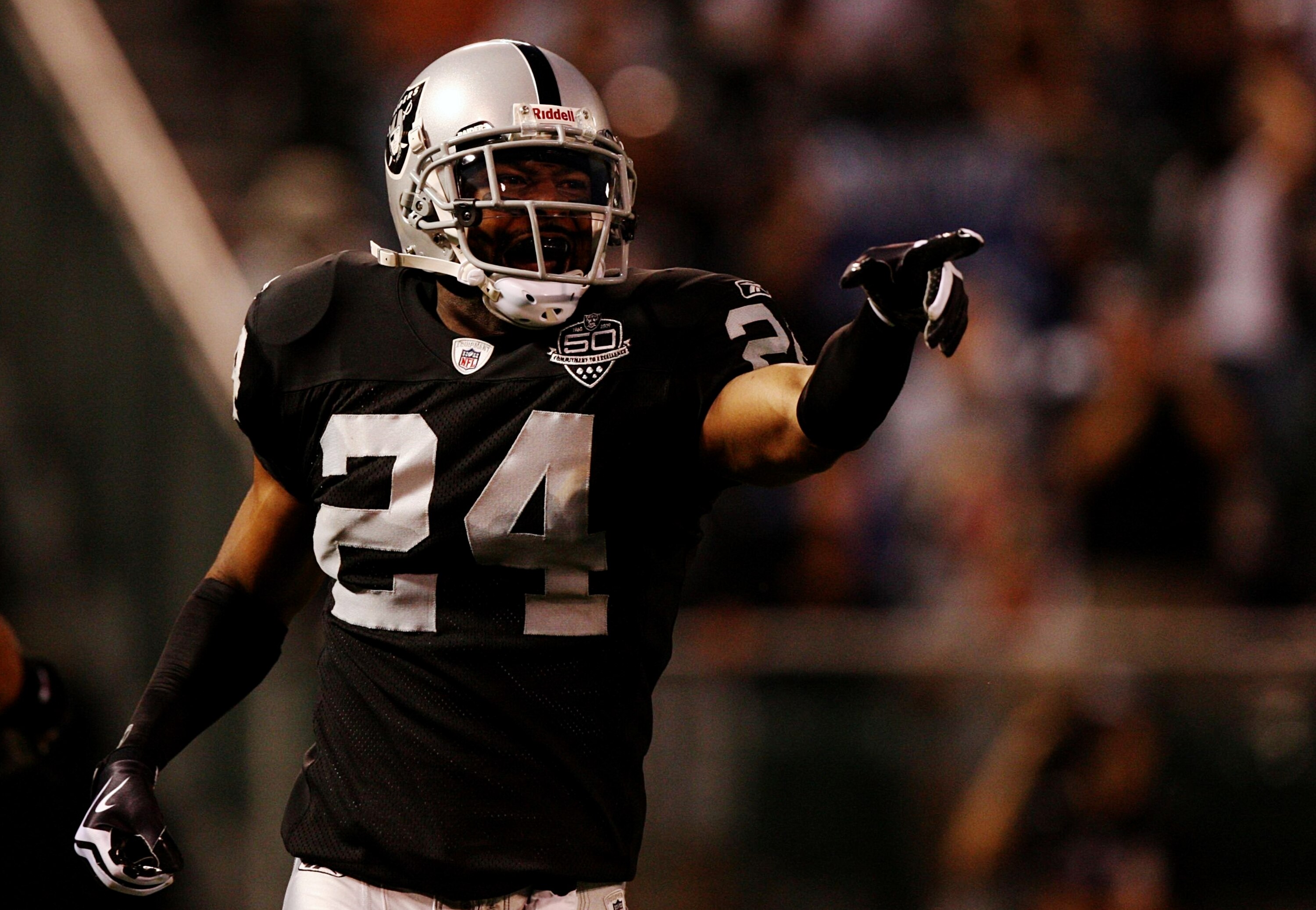 OAKLAND, CA - AUGUST 13:  Safety Michael Huff #24 of the Oakland Raiders celebrates after making an interception against the Dallas Cowboys during the preseason game at Oakland-Alameda County Coliseum on August 13, 2009 in Oakland, California. (Photo by J