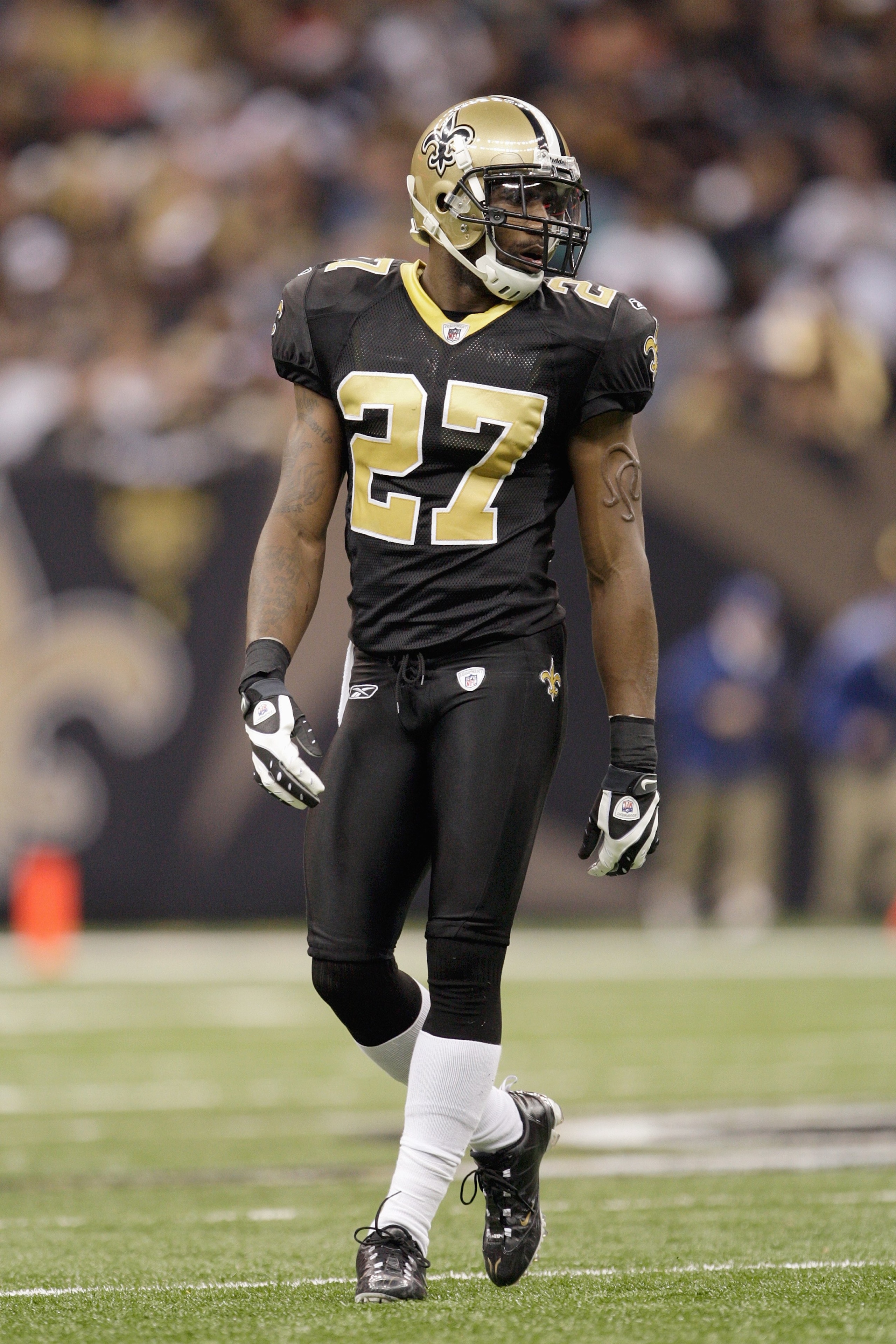 NEW ORLEANS - DECEMBER 27:  Malcolm Jenkins #27 of the New Orleans Saints walks on the field during the game against the Tampa Bay Buccaneers on December 27, 2009 at Louisiana Superdome in New Orleans, Louisiana. (Photo by Jamie Squire/Getty Images)