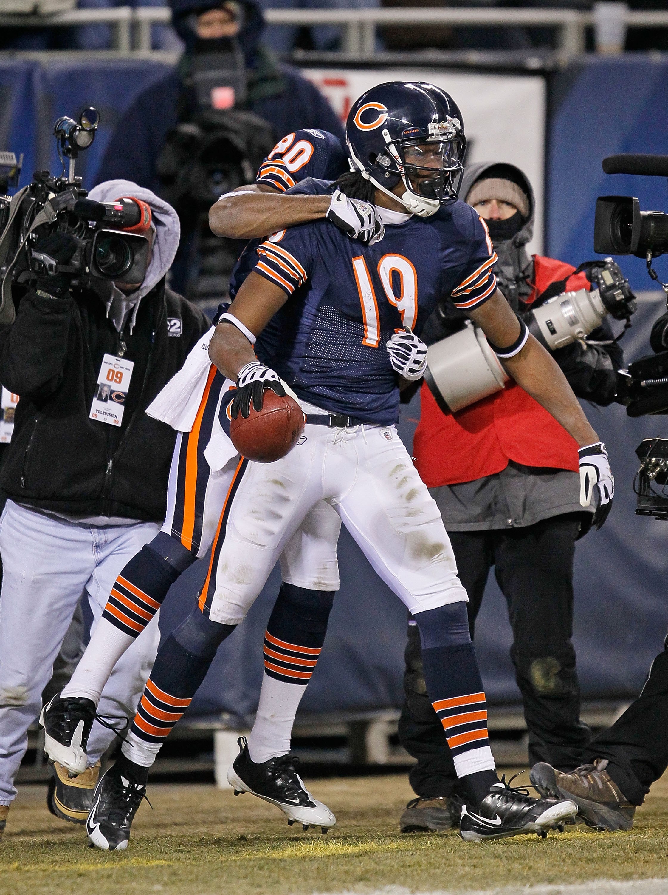 CHICAGO - DECEMBER 28: Devin Aromashodu #19 of the Chicago Bears is congratulated by teammate Earl Bennett #80 after catching the game-winning touchdown pass against the Minnesota Vikings at Soldier Field on December 28, 2009 in Chicago, Illinois. The Bea