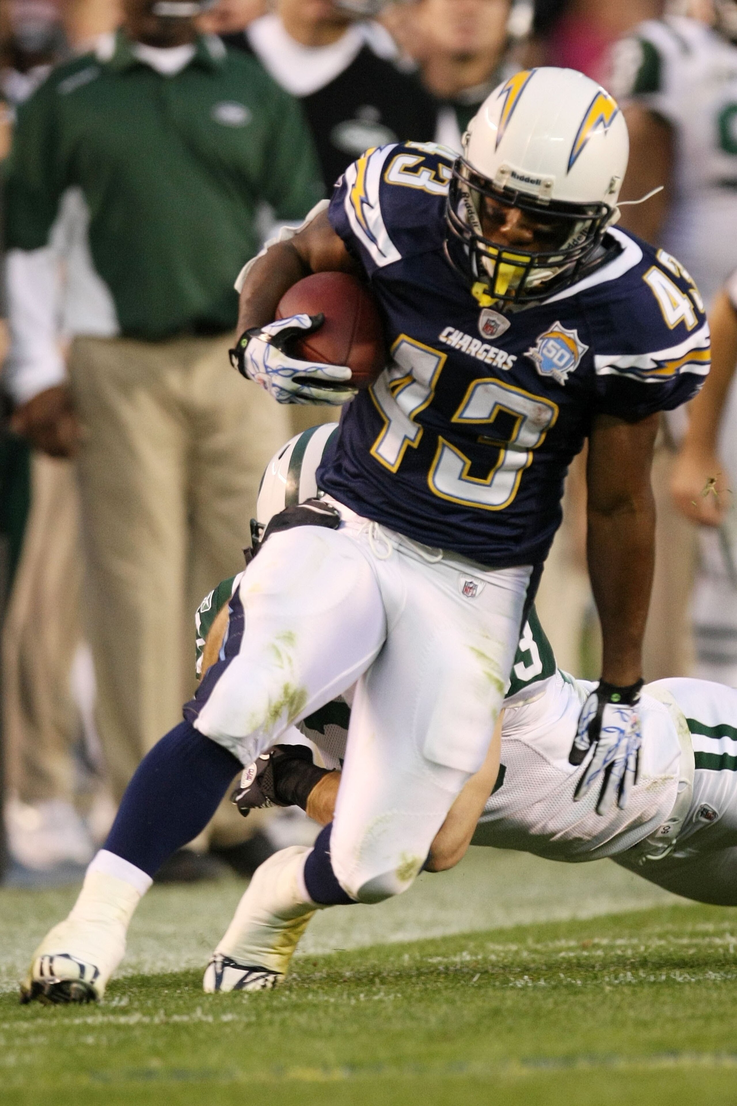 SAN DIEGO - JANUARY 17:  Running back Darren Sproles #43 of the San Diego Chargers runs with the ball during the AFC Divisional Playoff Game against the New York Jets at Qualcomm Stadium on January 17, 2010 in San Diego, California.  (Photo by Stephen Dun
