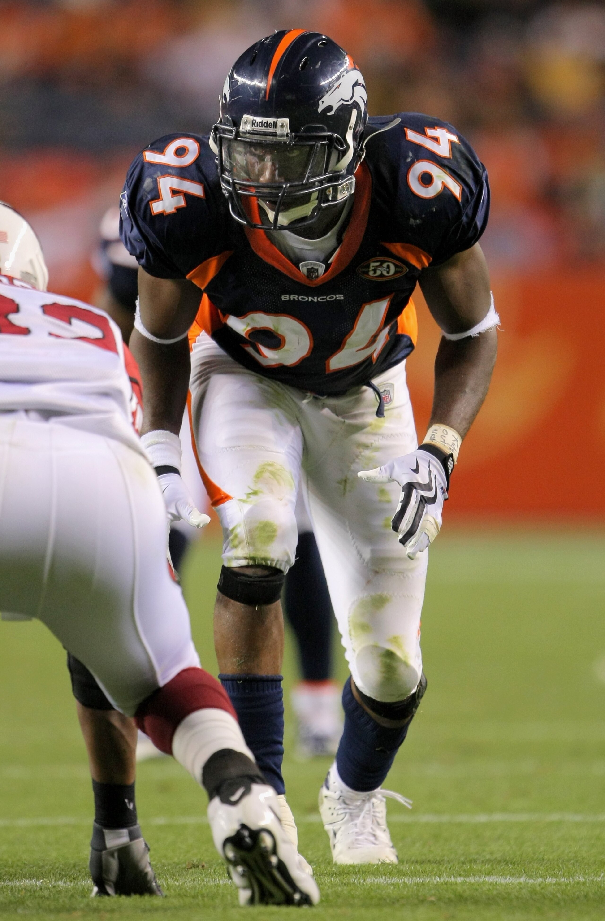 DENVER - SEPTEMBER 03:  Defensive end Jarvis Moss #94 of the Denver Broncos is poised on the line of scrimmage against the Arizona Cardinals during preseason NFL action at Invesco Field at Mile High on September 3, 2009 in Denver, Colorado. The Broncos de