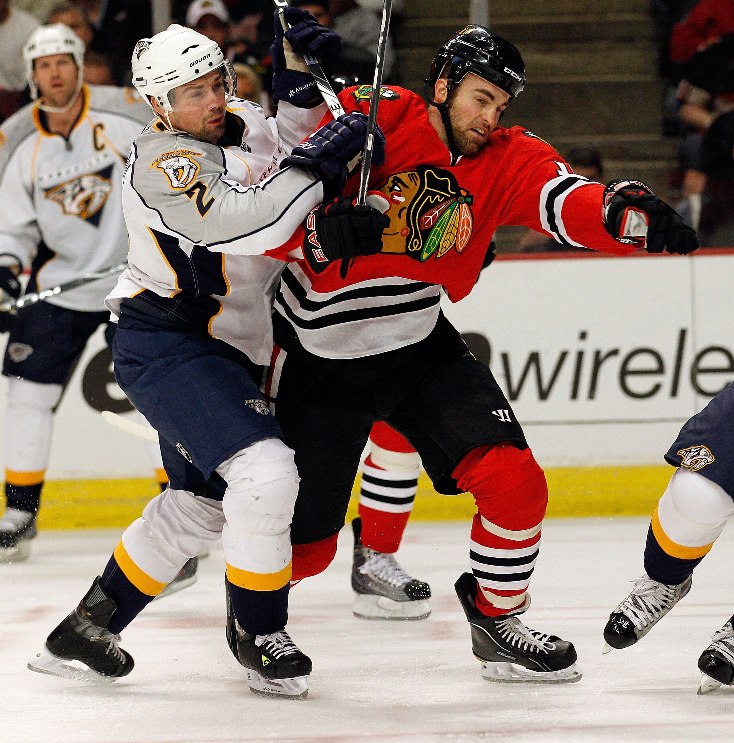 CHICAGO - APRIL 24: Andrew Ladd #16 of the Chicago Blackhawks battles with Dan Hamhuis #2 of the Nashville Predators in Game Five of the Western Conference Quarterfinals during the 2010 NHL Stanley Cup Playoffs at the United Center on April 24, 2010 in Ch CHICAGO - APRIL 24: Andrew Ladd #16 of the Chicago Blackhawks battles with Dan Hamhuis #2 of the Nashville Predators in Game Five of the Western Conference Quarterfinals during the 2010 NHL Stanley Cup Playoffs at the United Center on April 24, 2010 in Ch