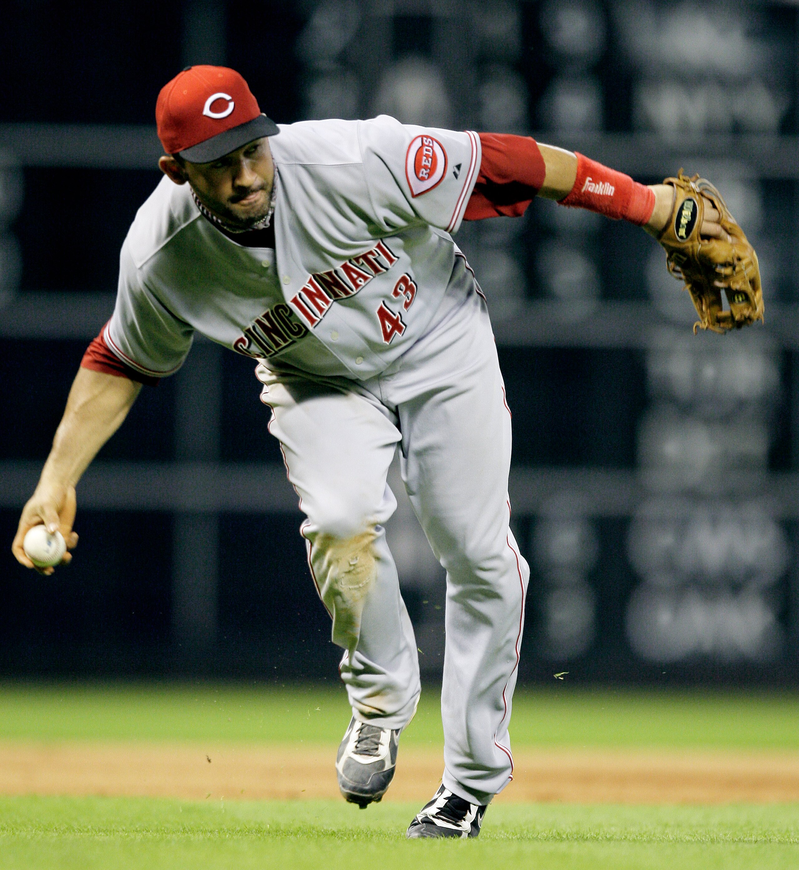 HOUSTON - JULY 23: Third baseman Miguel Cairo #43 of the Cincinnati Reds makes a play on a slow roller against the Houston Astros at Minute Maid Park on July 23, 2010 in Houston, Texas. (Photo by Bob Levey/Getty Images) HOUSTON - JULY 23: Third baseman Miguel Cairo #43 of the Cincinnati Reds makes a play on a slow roller against the Houston Astros at Minute Maid Park on July 23, 2010 in Houston, Texas. (Photo by Bob Levey/Getty Images)