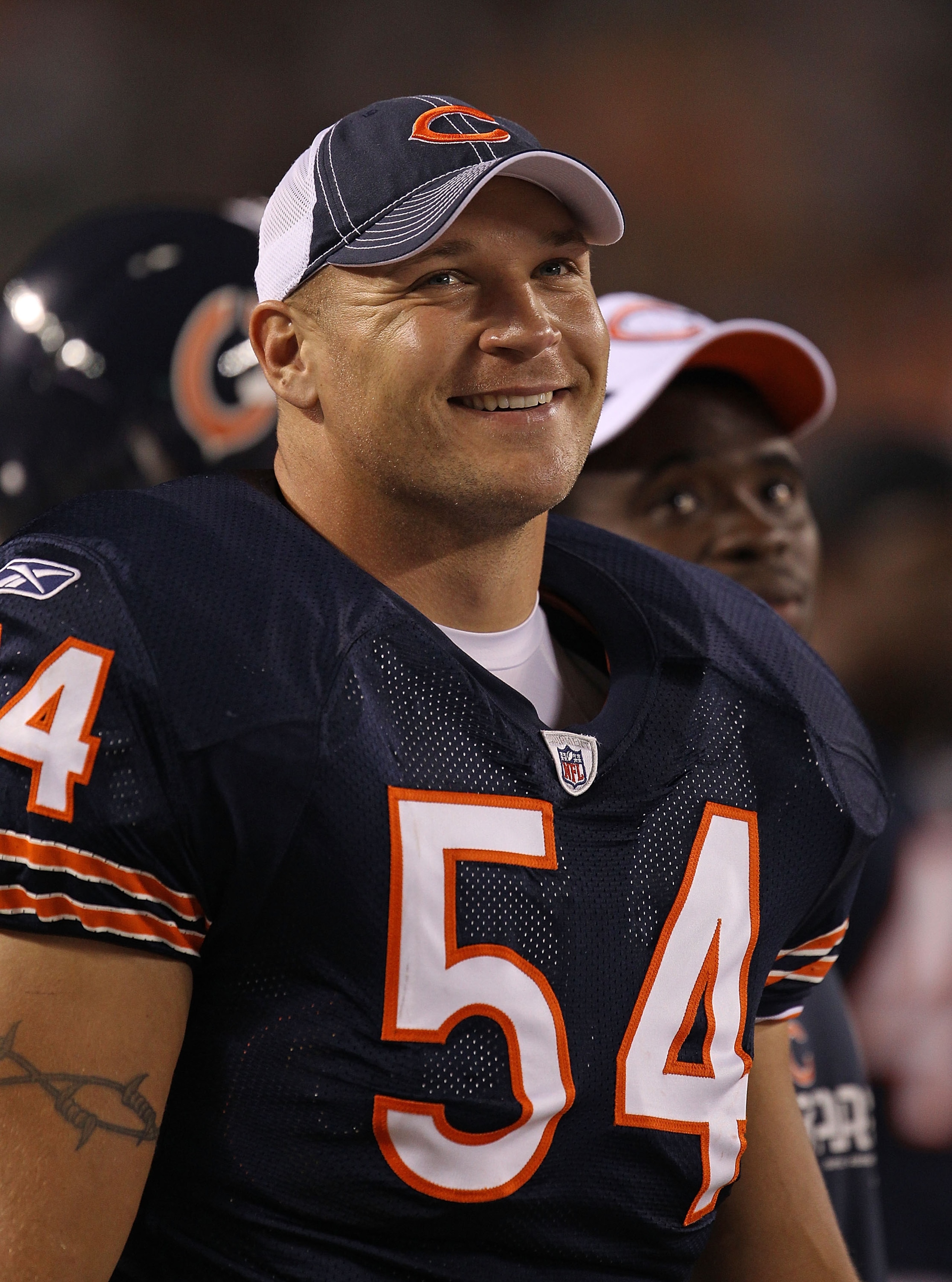 CHICAGO - AUGUST 21: Brian Urlacher #54 of the Chicago Bears smiles on the sidelines during a preseason game against the Oakland Raiders at Soldier Field on August 21, 2010 in Chicago, Illinois. The Raiders defeated the Bears 32-17. (Photo by Jonathan Dan CHICAGO - AUGUST 21: Brian Urlacher #54 of the Chicago Bears smiles on the sidelines during a preseason game against the Oakland Raiders at Soldier Field on August 21, 2010 in Chicago, Illinois. The Raiders defeated the Bears 32-17. (Photo by Jonathan Dan