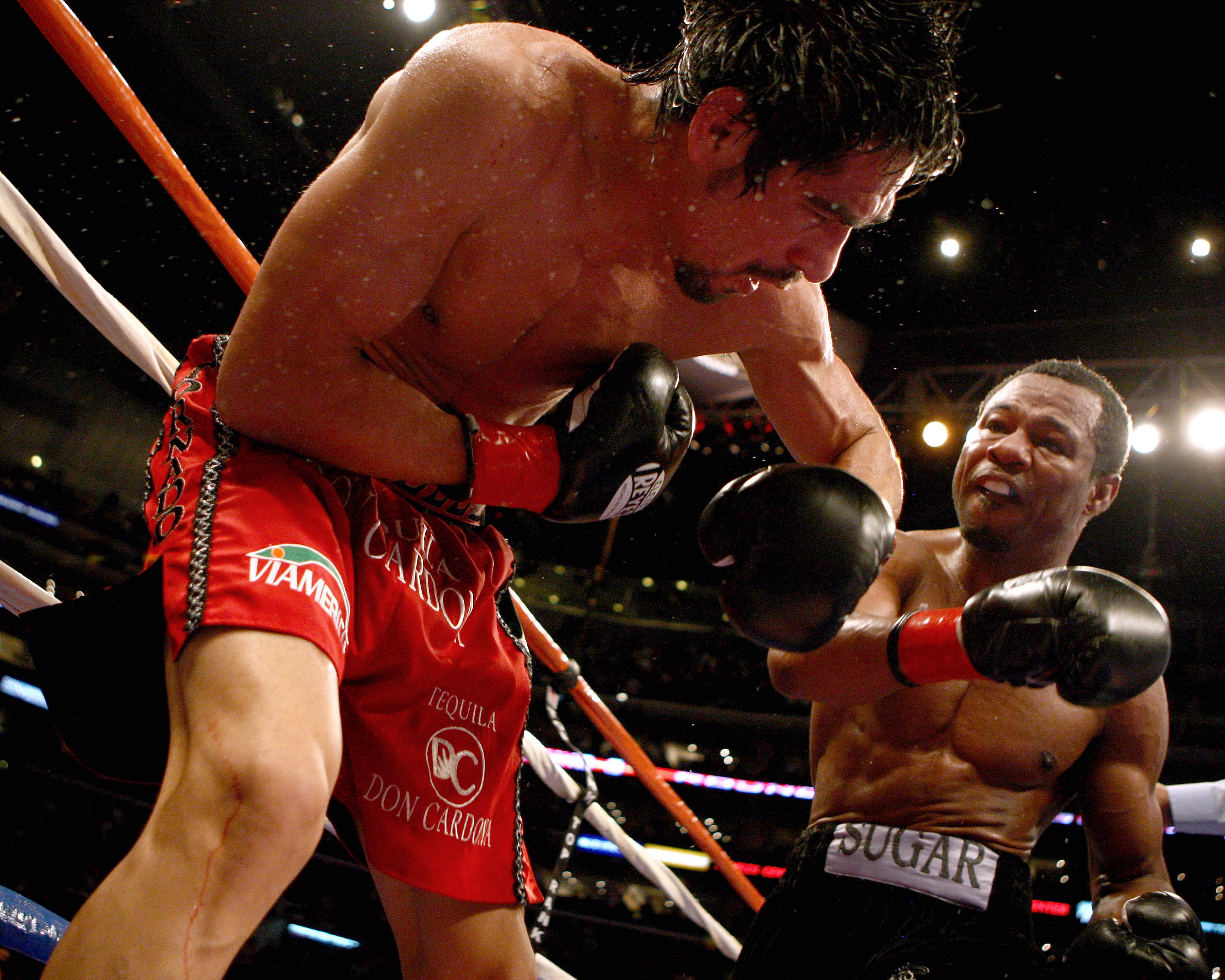 LOS ANGELES - JANUARY 24:   Shane Mosley lands a punch on Antonio Margarito en route to his TKO in the ninth round after Margarito's corner threw in the towel during their WBA welterweight title fight on January 24, 2009 at the Staples Center in Los Angel