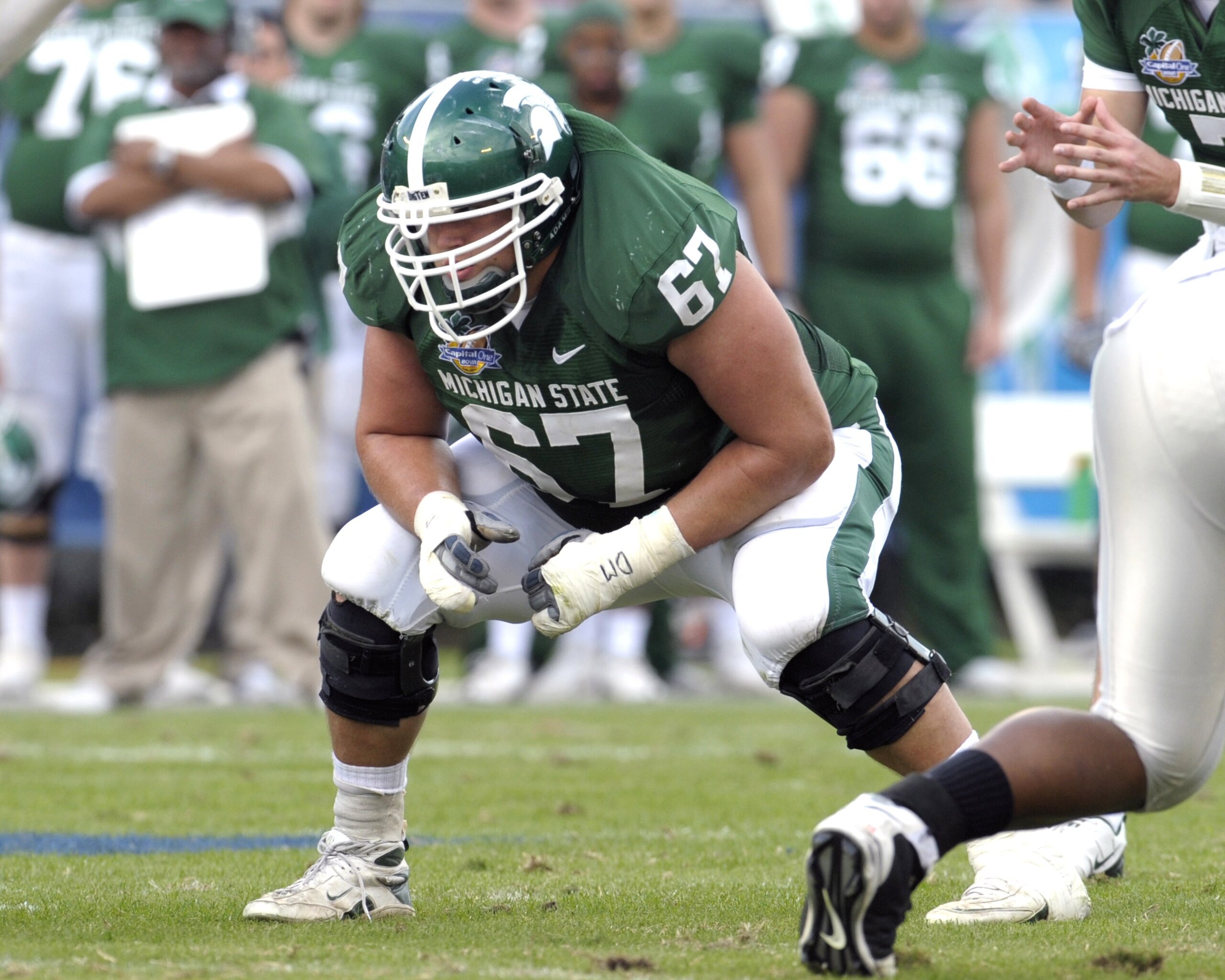 ORLANDO, FL - JANUARY 1: Guard Joel Foreman #67 of the Michigan State Spartans sets to block against the Georgia Bulldogs at the 2009 Capital One Bowl at the Citrus Bowl on January 1, 2009 in Orlando, Florida.  (Photo by Al Messerschmidt/Getty Images)