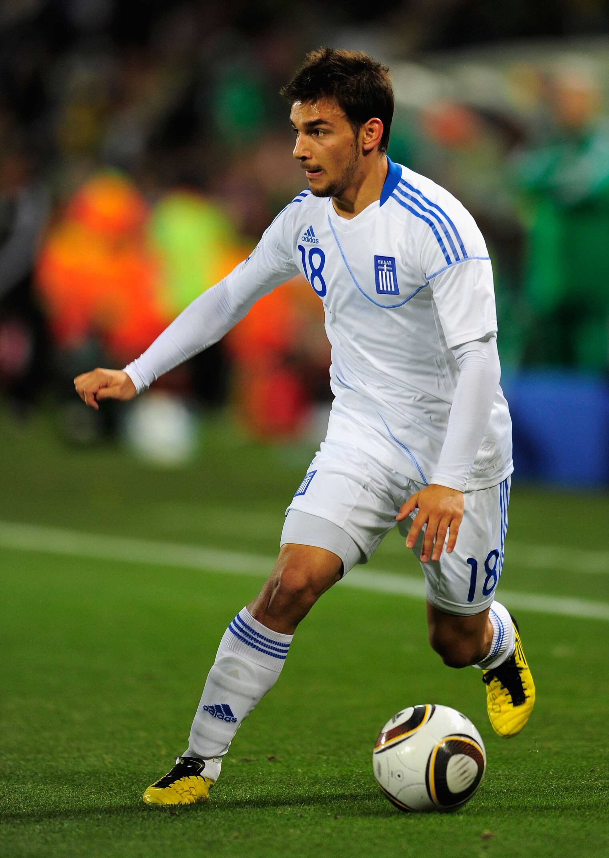 BLOEMFONTEIN, SOUTH AFRICA - JUNE 17: Sotiris Ninis of Greece in action during the 2010 FIFA World Cup South Africa Group B match between Greece and Nigeria at the Free State Stadium on June 17, 2010 in Mangaung/Bloemfontein, South Africa.  (Photo by Stua