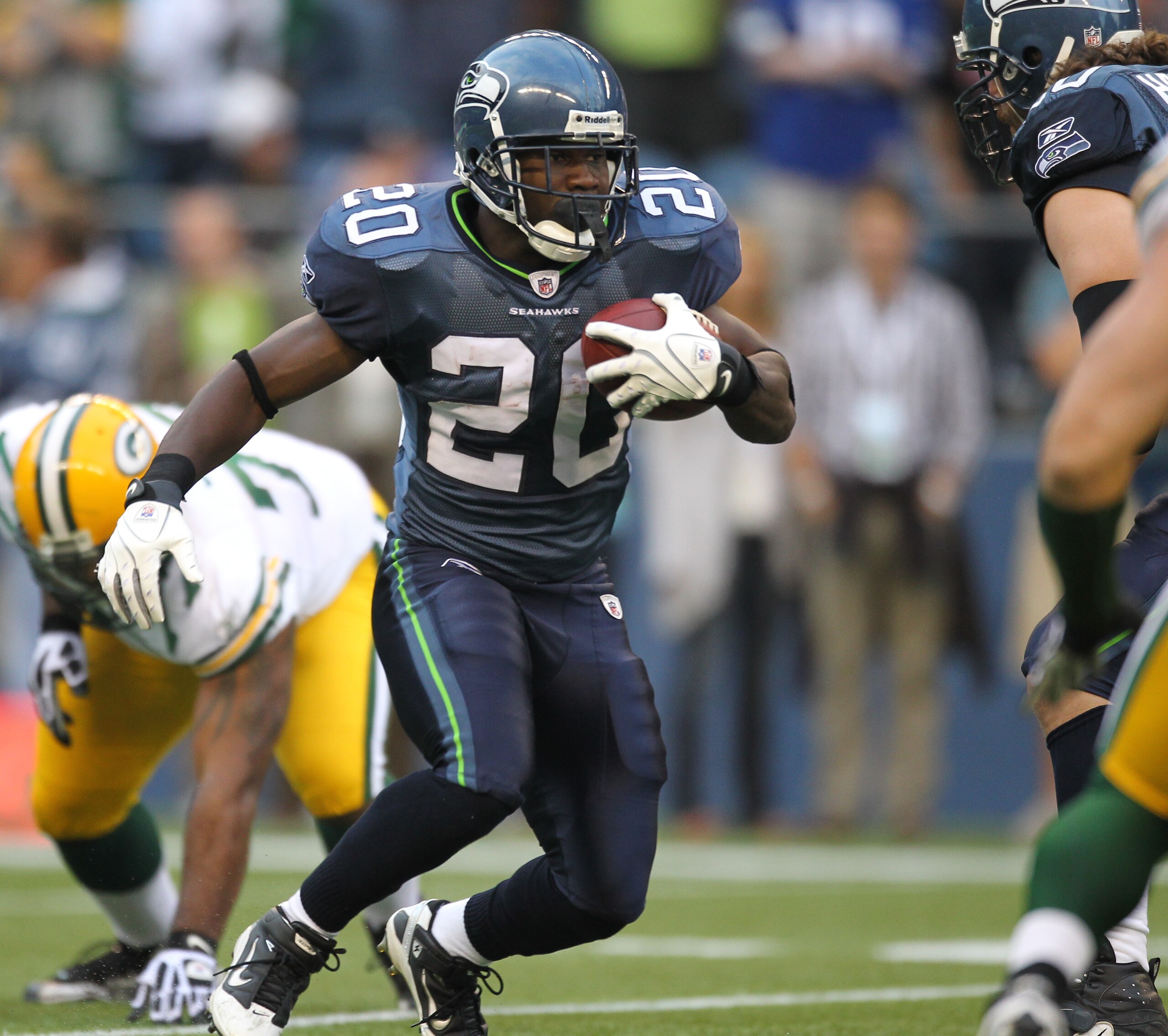 SEATTLE - AUGUST 21: Running back Justin Forsett #20 of the Seattle Seahawks rushes during the preseason game against Cullen Jenkins #77 of the Green Bay Packers at Qwest Field on August 21, 2010 in Seattle, Washington. (Photo by Otto Greule Jr/Getty Ima SEATTLE - AUGUST 21: Running back Justin Forsett #20 of the Seattle Seahawks rushes during the preseason game against Cullen Jenkins #77 of the Green Bay Packers at Qwest Field on August 21, 2010 in Seattle, Washington. (Photo by Otto Greule Jr/Getty Ima