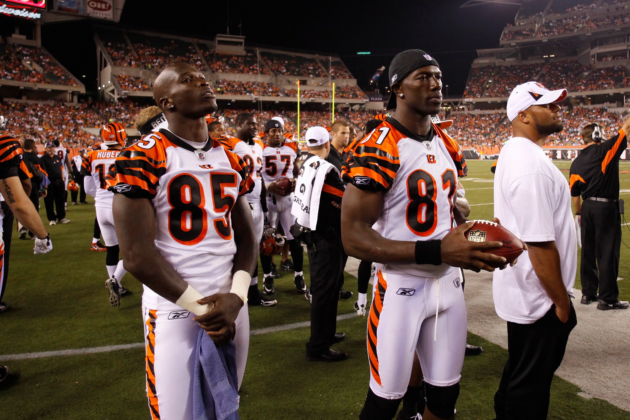 CINCINNATI, OH - AUGUST 15: Terrell Owens #81 and Chad Ochocinco #85 of the Cincinnati Bengals look on during the preseason game against the Denver Broncos at Paul Brown Stadium on August 15, 2010 in Cincinnati, Ohio. The Bengals won 33-24. (Photo by Joe CINCINNATI, OH - AUGUST 15: Terrell Owens #81 and Chad Ochocinco #85 of the Cincinnati Bengals look on during the preseason game against the Denver Broncos at Paul Brown Stadium on August 15, 2010 in Cincinnati, Ohio. The Bengals won 33-24. (Photo by Joe