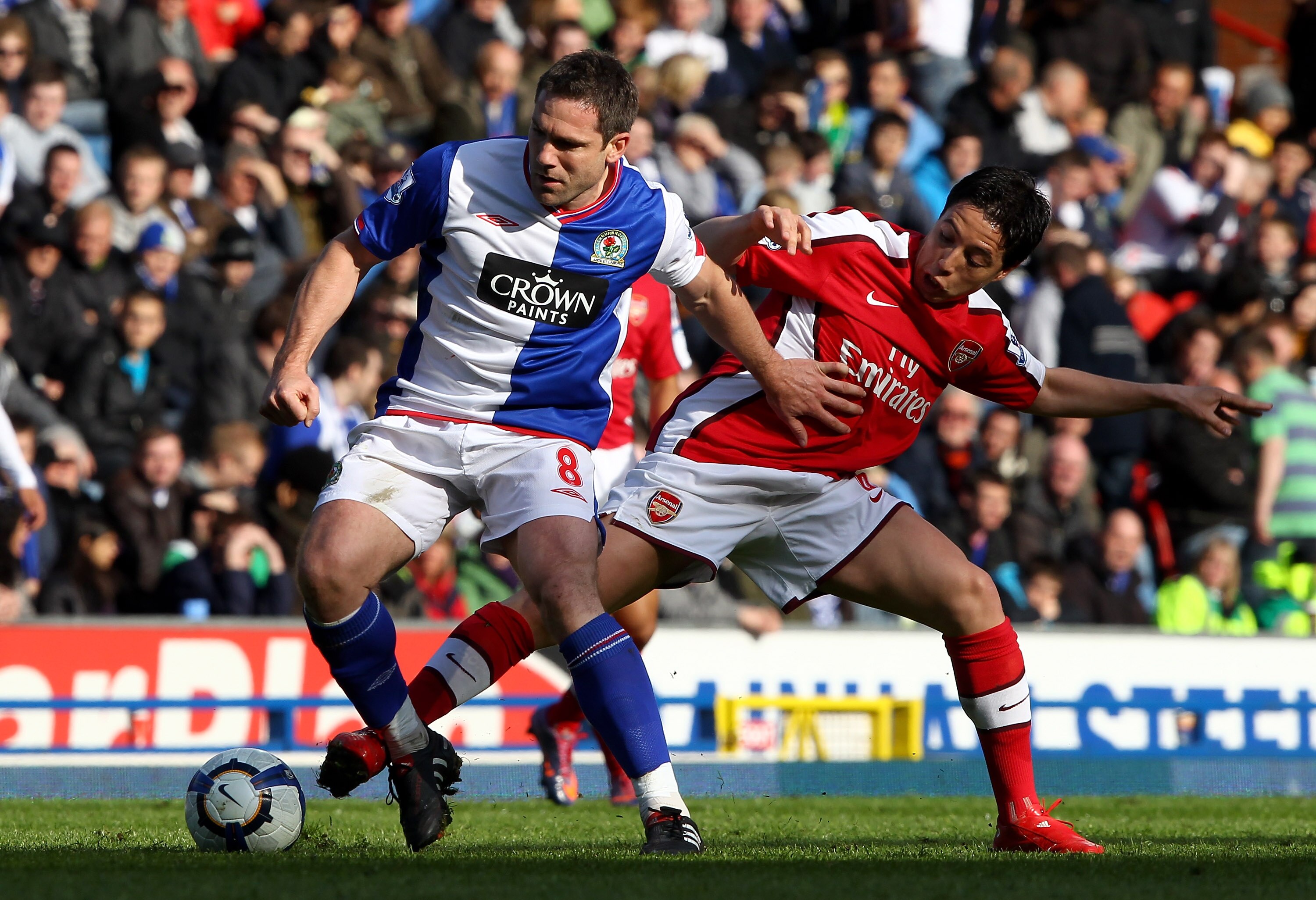 BLACKBURN, ENGLAND - MAY 03:  David Dunn of Blackburn Rovers holds off a challenge from Samir Nasri of Arsenal during the Barclays Premier League match between Blackburn Rovers and Arsenal at Ewood Park on May 3, 2010 in Blackburn, England.  (Photo by Cli